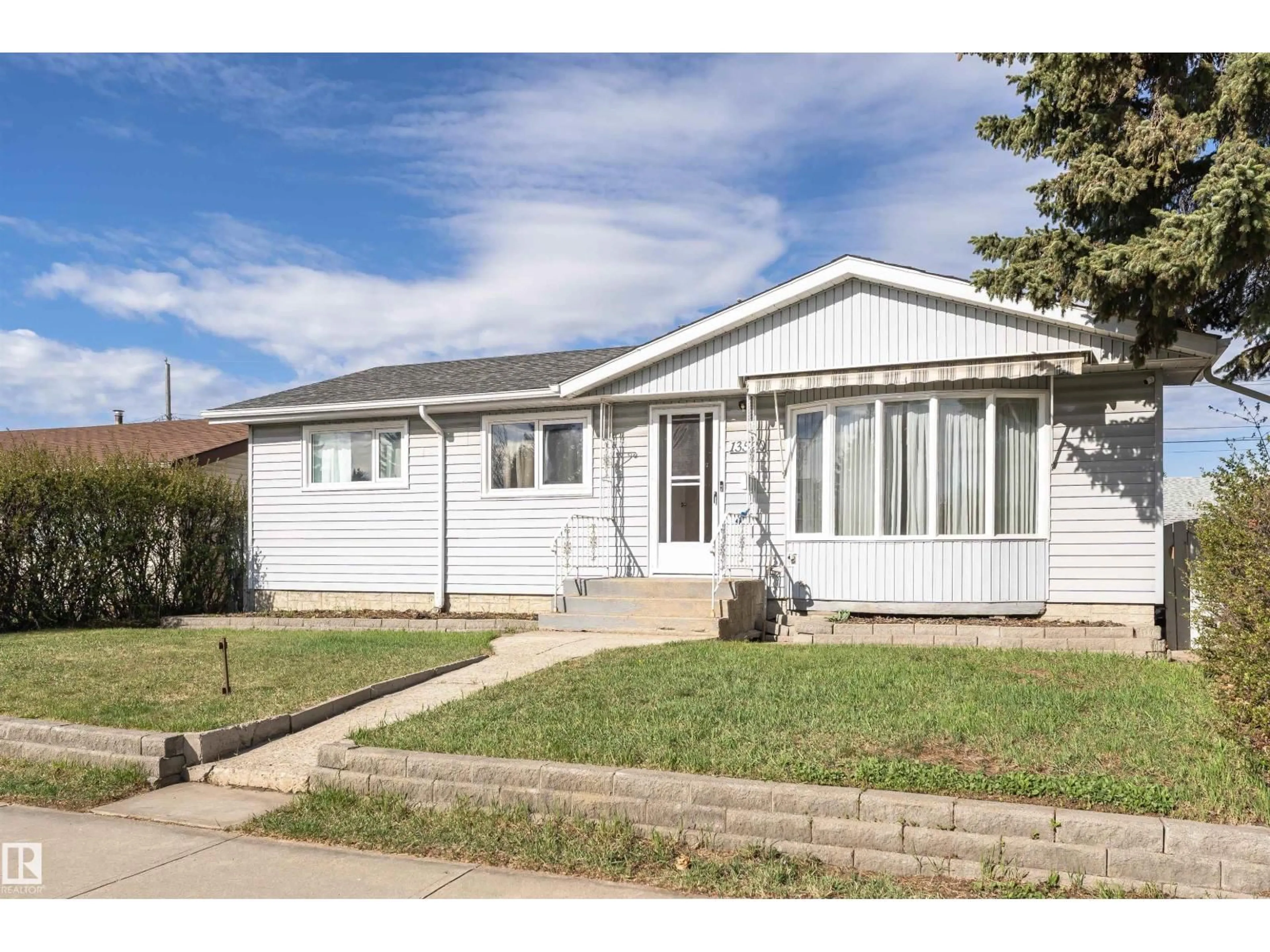 Home with vinyl exterior material, street for 13520 113A ST NW, Edmonton Alberta T5E5C4