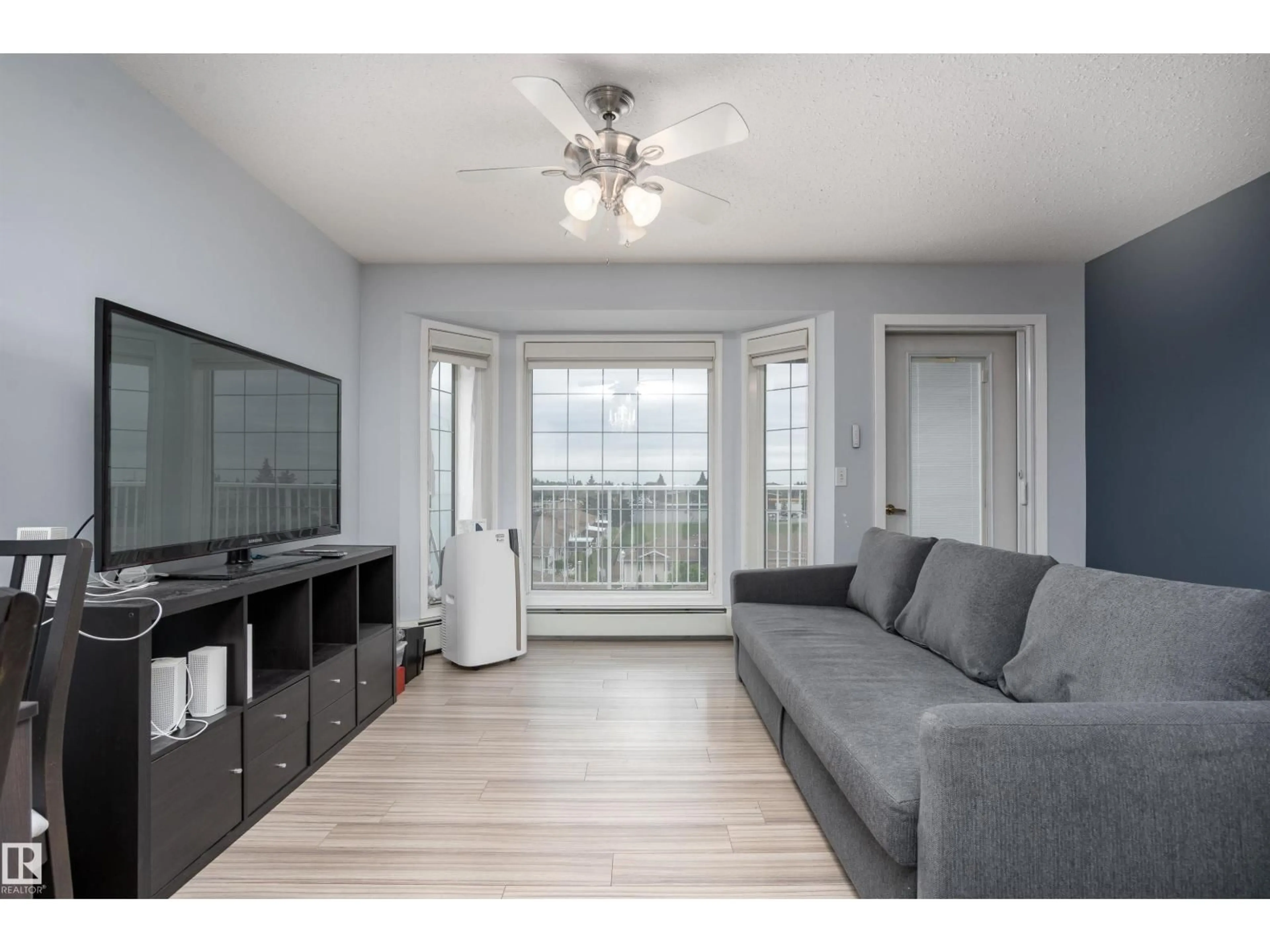 Living room with furniture, wood/laminate floor for #456 - 13441 127 ST, Edmonton Alberta T5L5B6