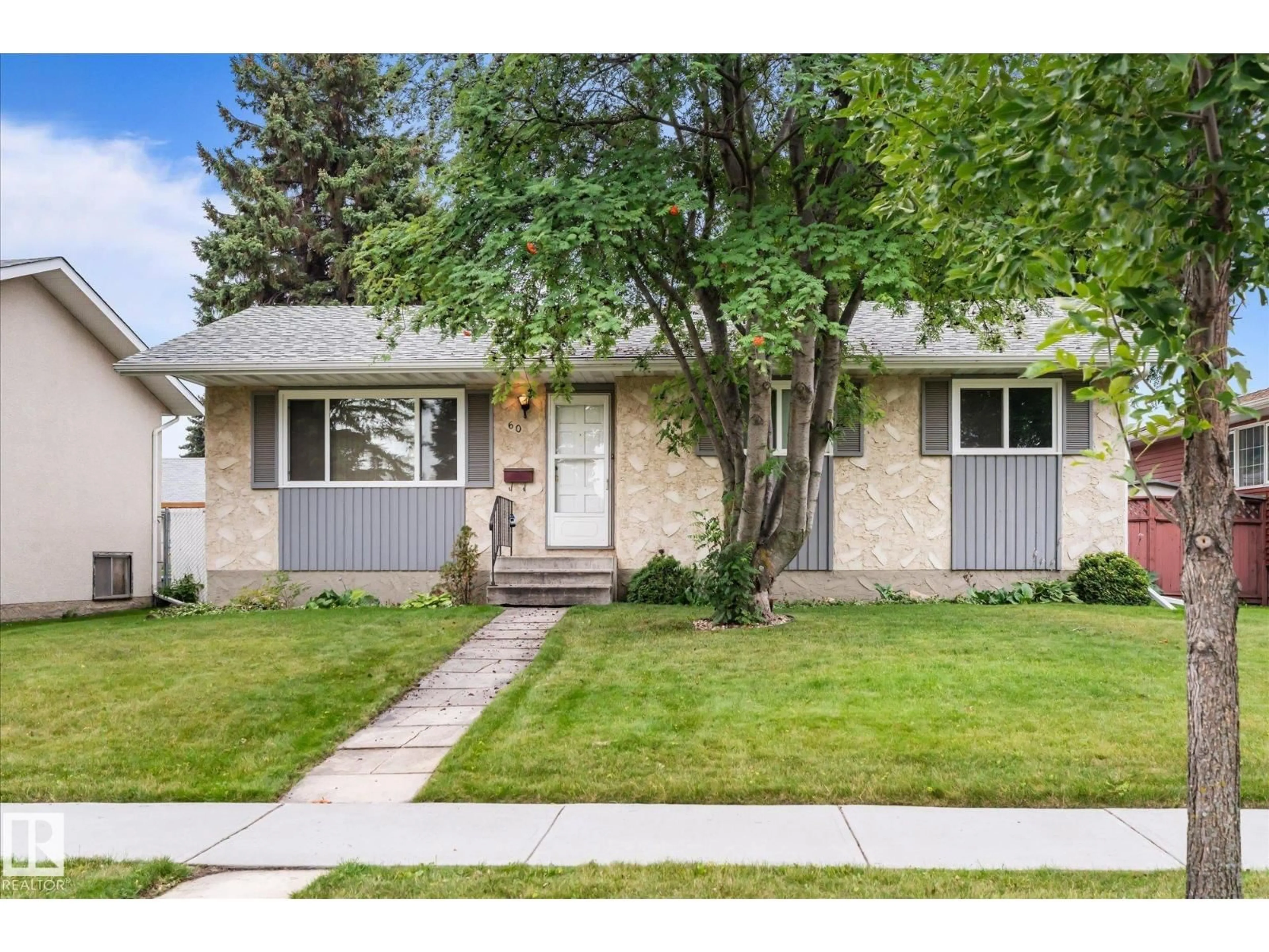 Home with vinyl exterior material, street for 60 WOODHAVEN DR, Spruce Grove Alberta T7X1M8