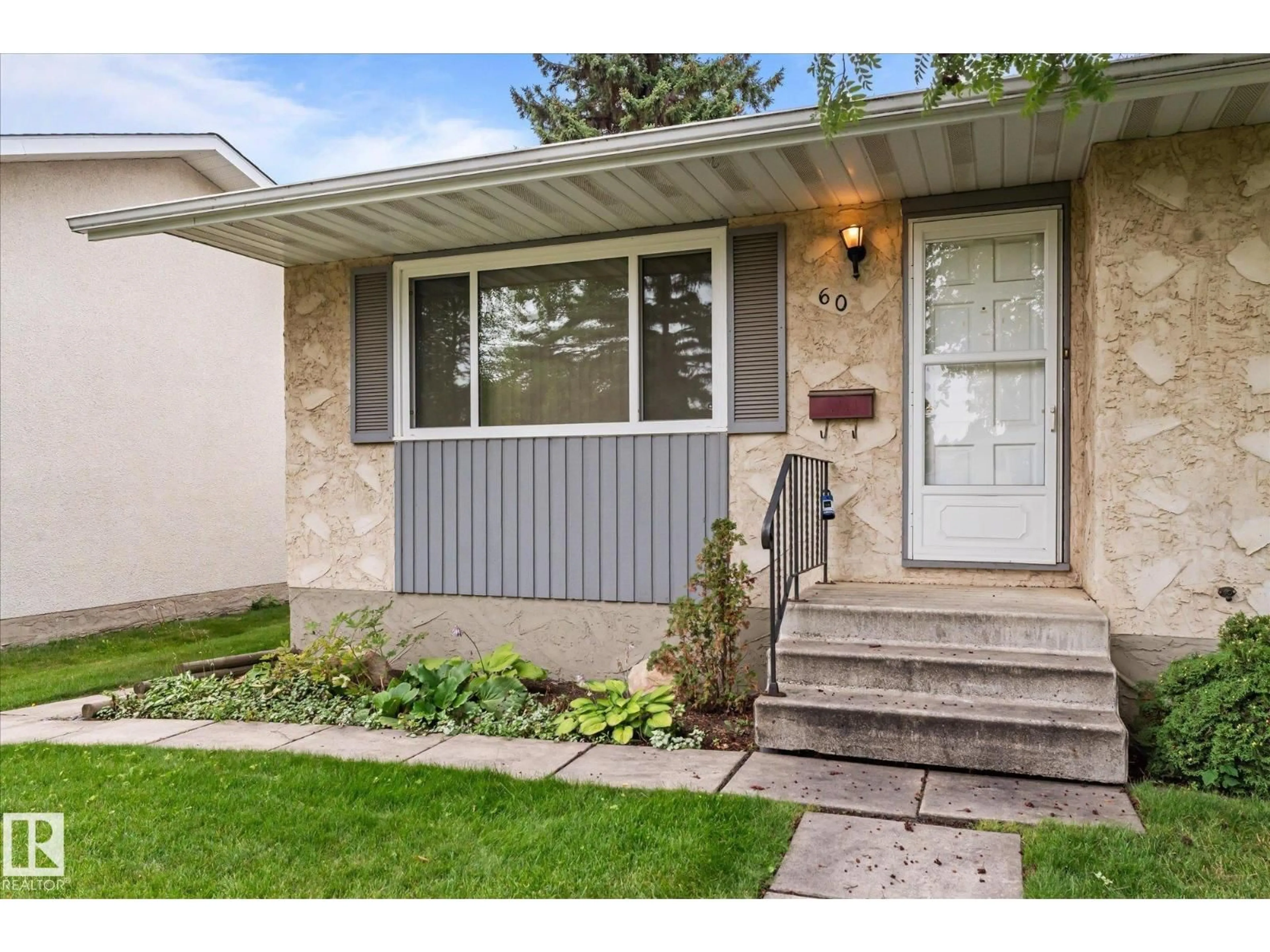 Home with vinyl exterior material, street for 60 WOODHAVEN DR, Spruce Grove Alberta T7X1M8