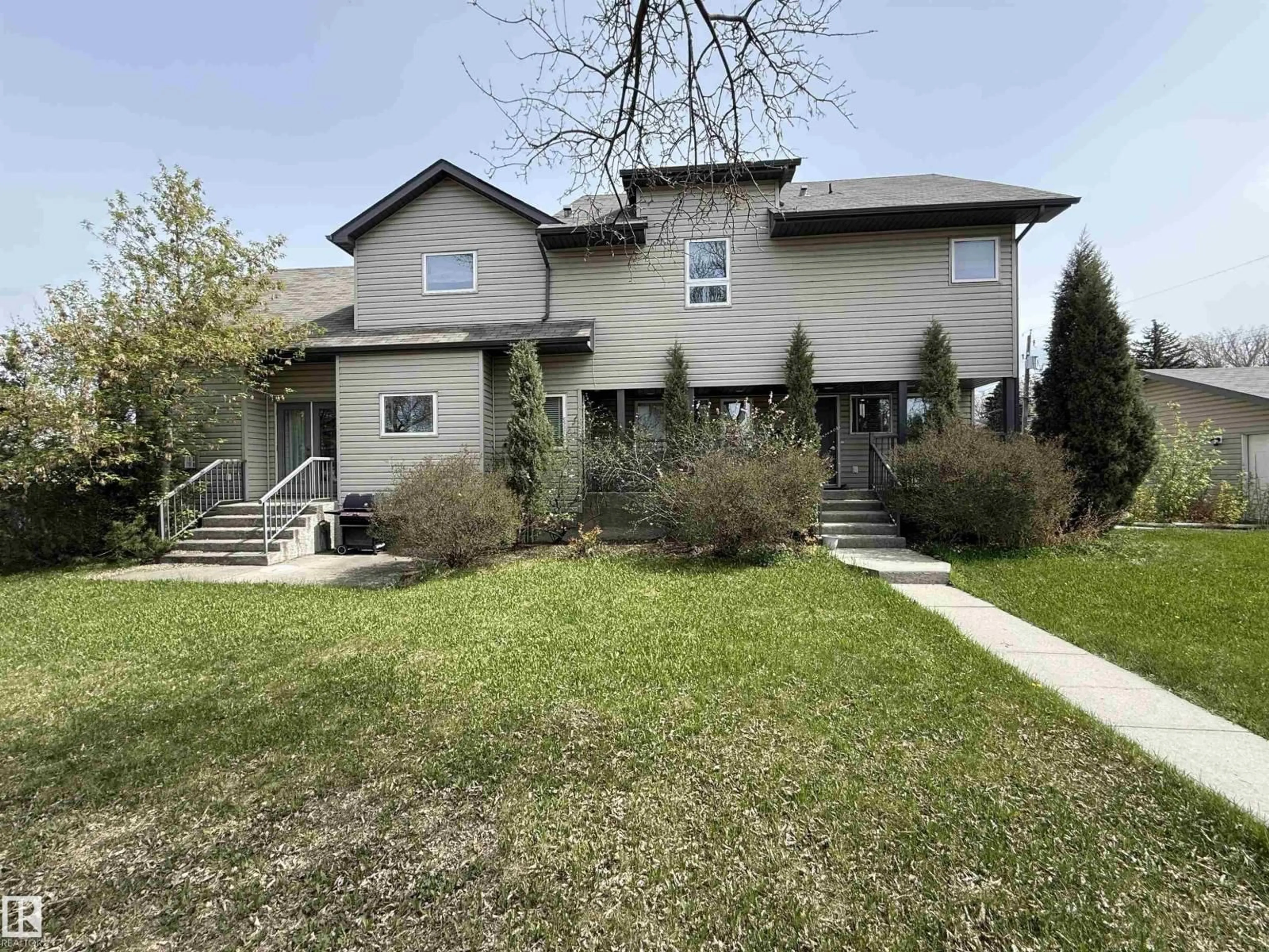 Home with vinyl exterior material, street for 10651 68 AVE AND 6711 107 STREET AV NW, Edmonton Alberta T6H2B3