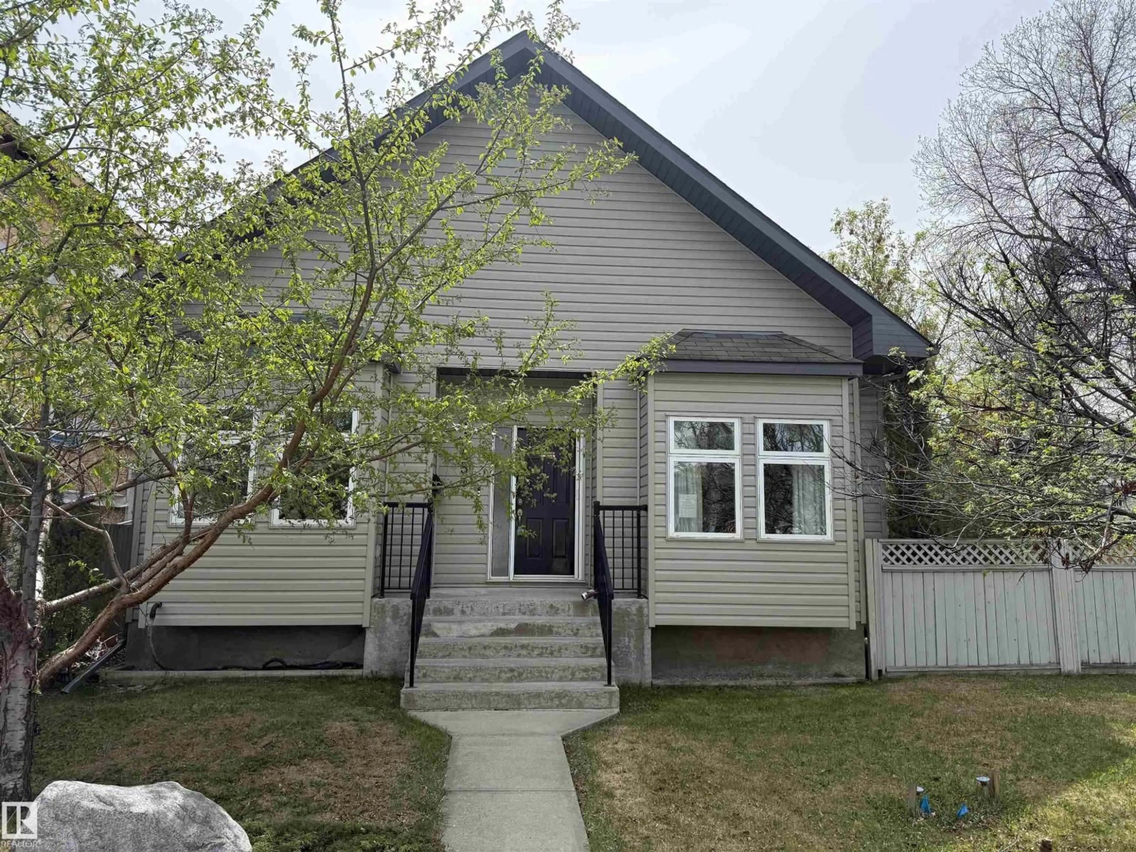 Home with vinyl exterior material, street for 10651 68 AVE AND 6711 107 STREET AV NW, Edmonton Alberta T6H2B3