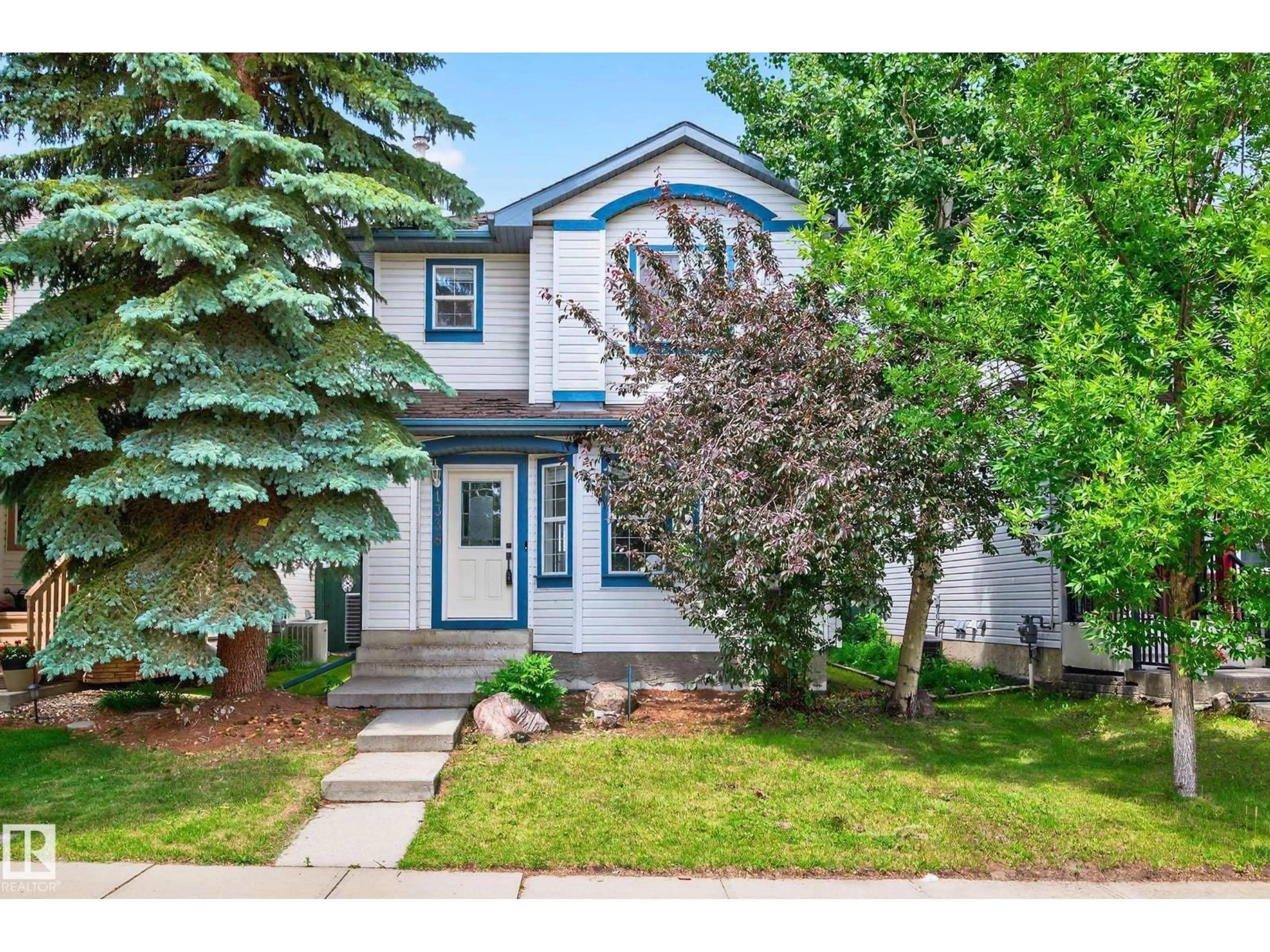 Home with vinyl exterior material, street for 1338 GRANT WY, Edmonton Alberta T5T6M8