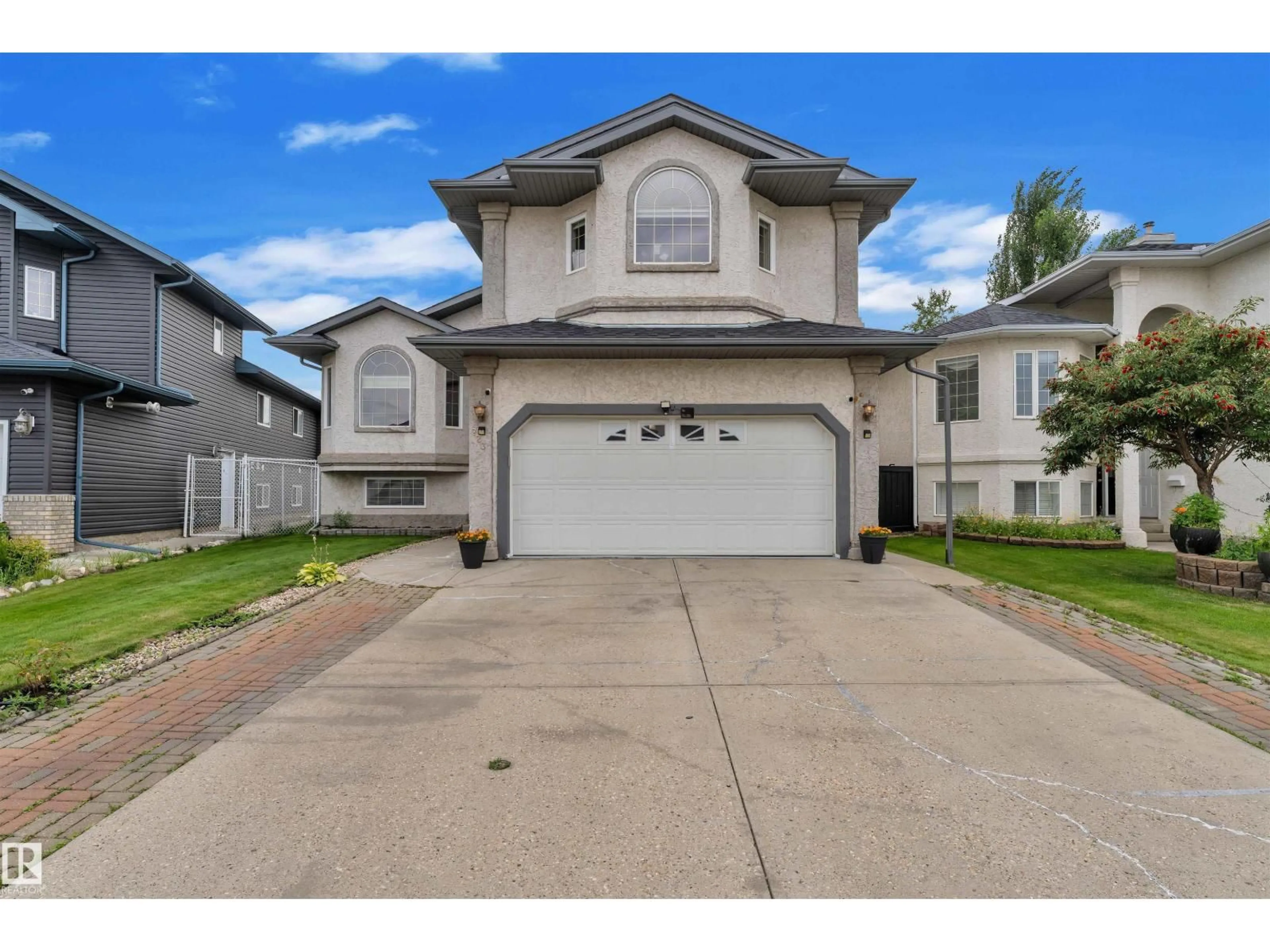 Home with vinyl exterior material, street for 723 KIRKNESS RD, Edmonton Alberta T5Y2Y8