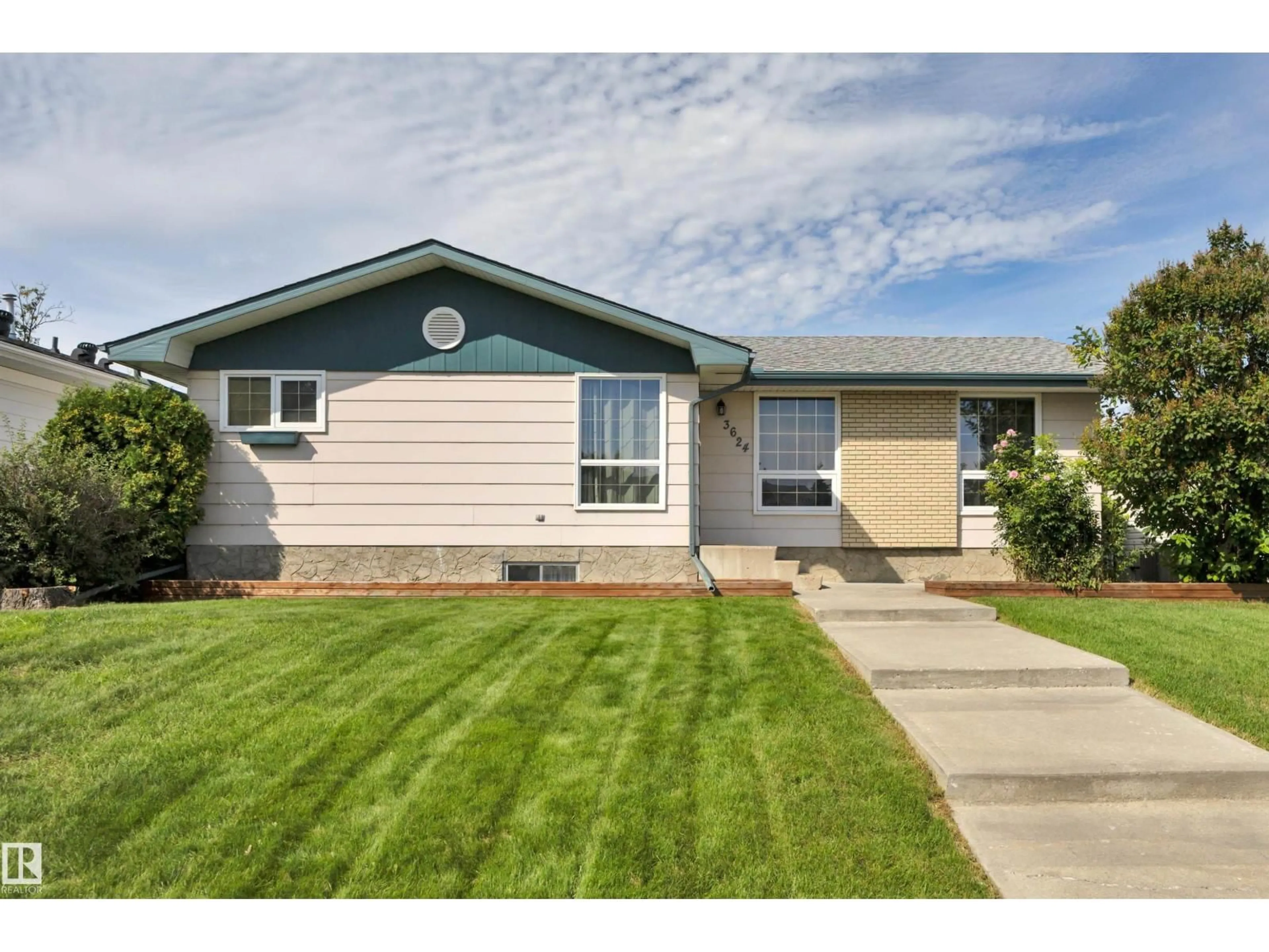 Home with vinyl exterior material, street for 3624 107 ST, Edmonton Alberta T6J1B1
