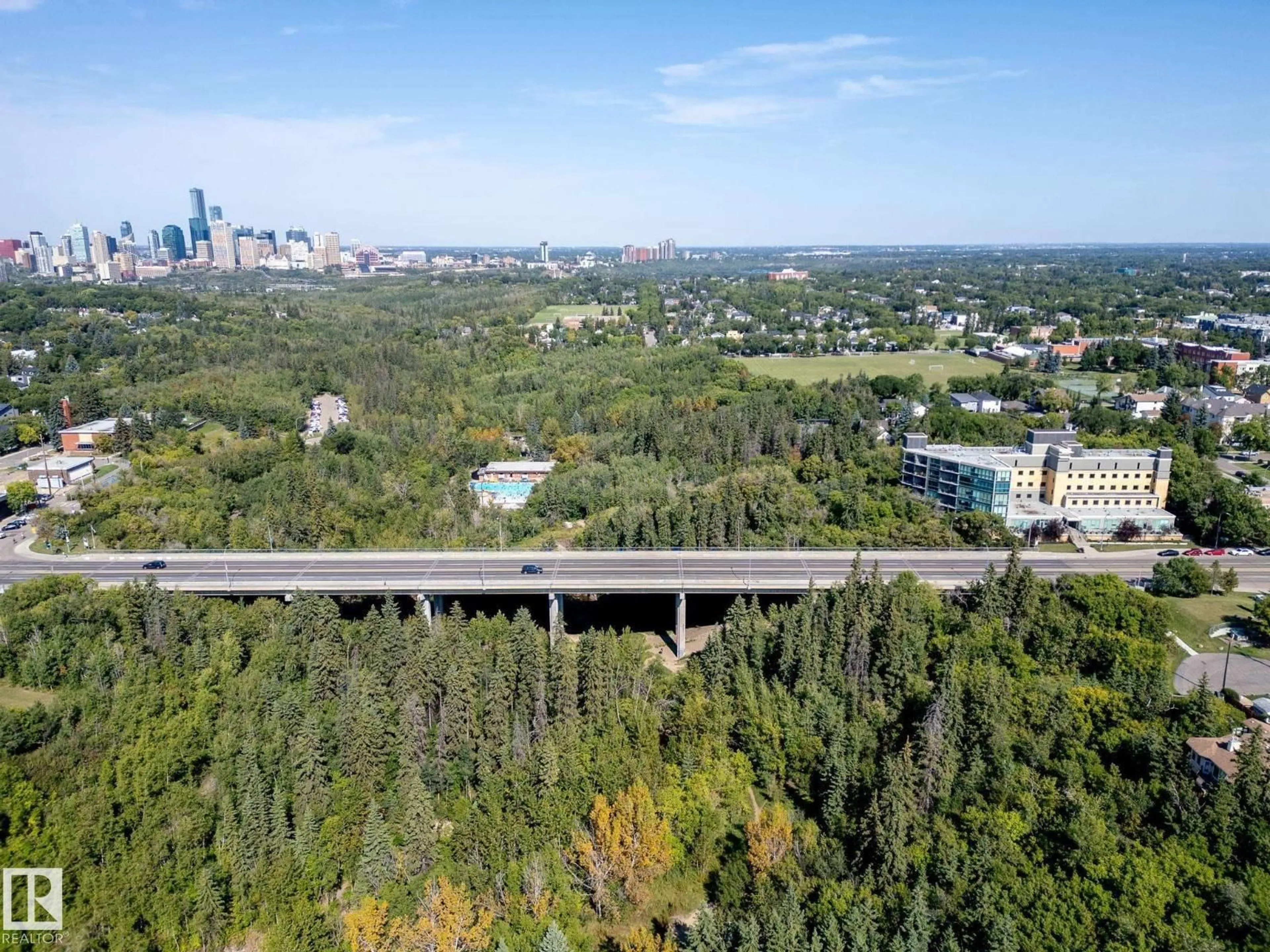 A pic from outside/outdoor area/front of a property/back of a property/a pic from drone, forest/trees view for #306 - 9316 82 AV, Edmonton Alberta T6C0Z6