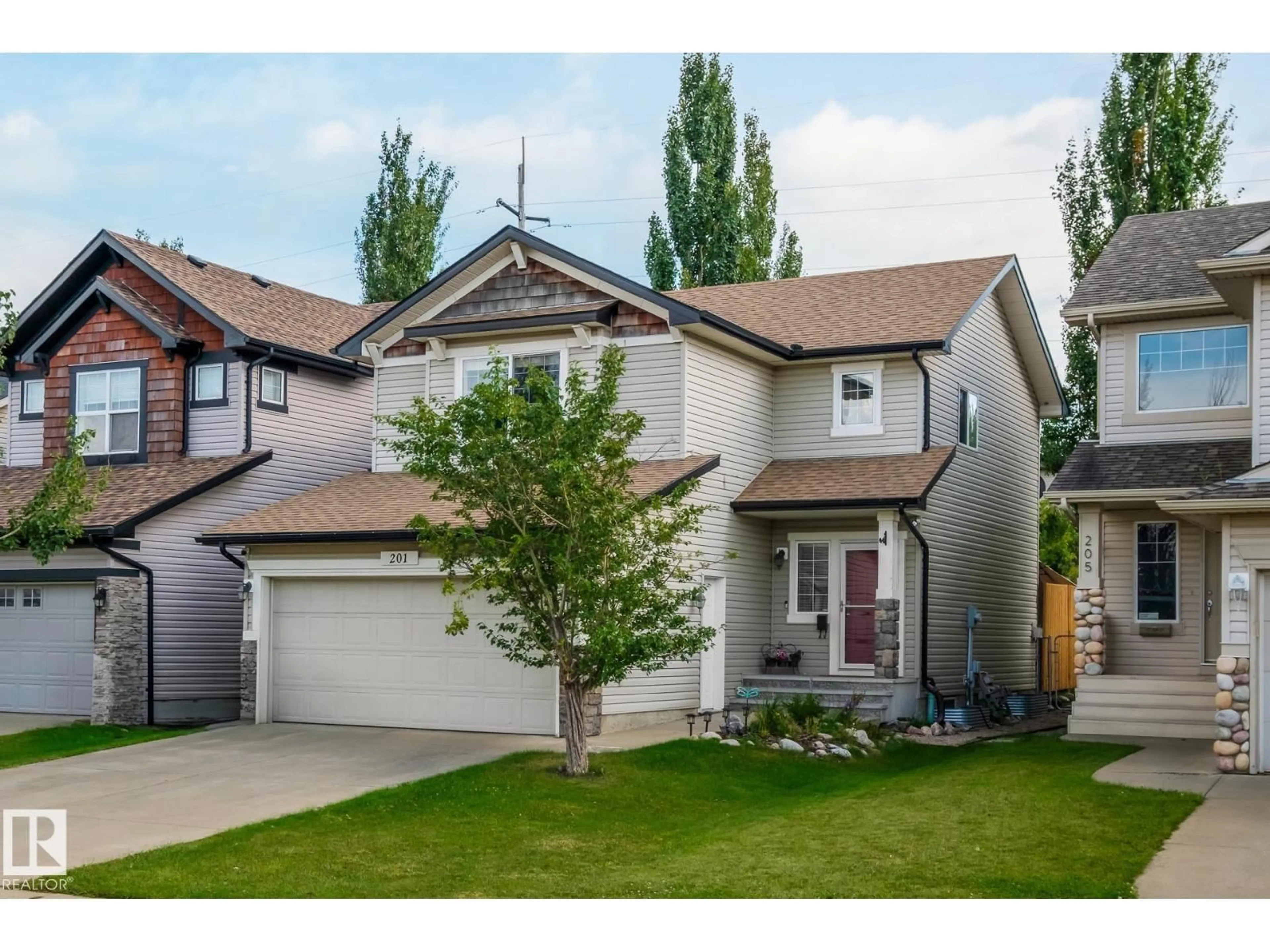 Home with vinyl exterior material, street for 201 CORNWALL RD, Sherwood Park Alberta T8H2L8