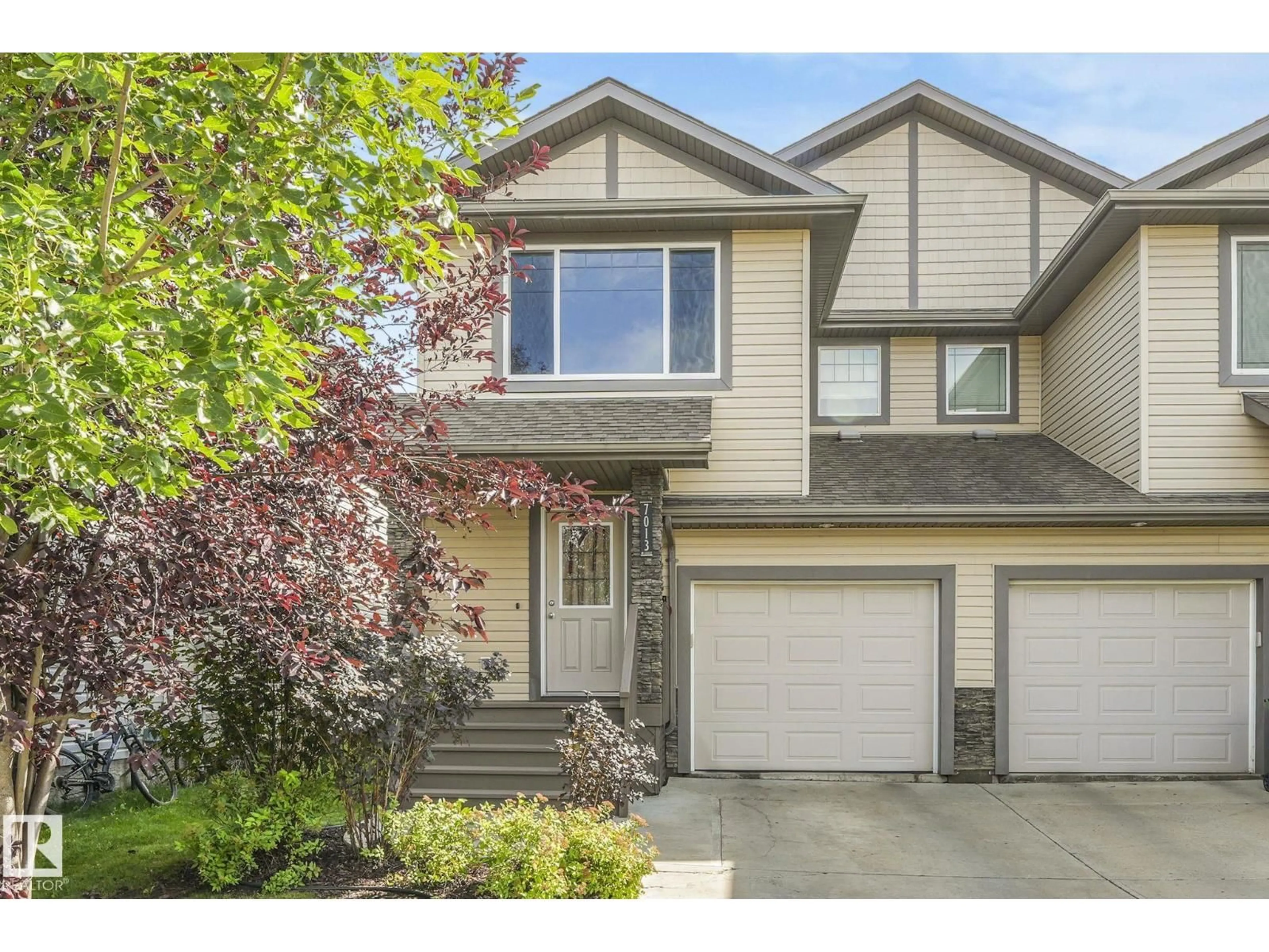 Home with vinyl exterior material, street for 7013 CARDINAL WY, Edmonton Alberta T6W1Z1