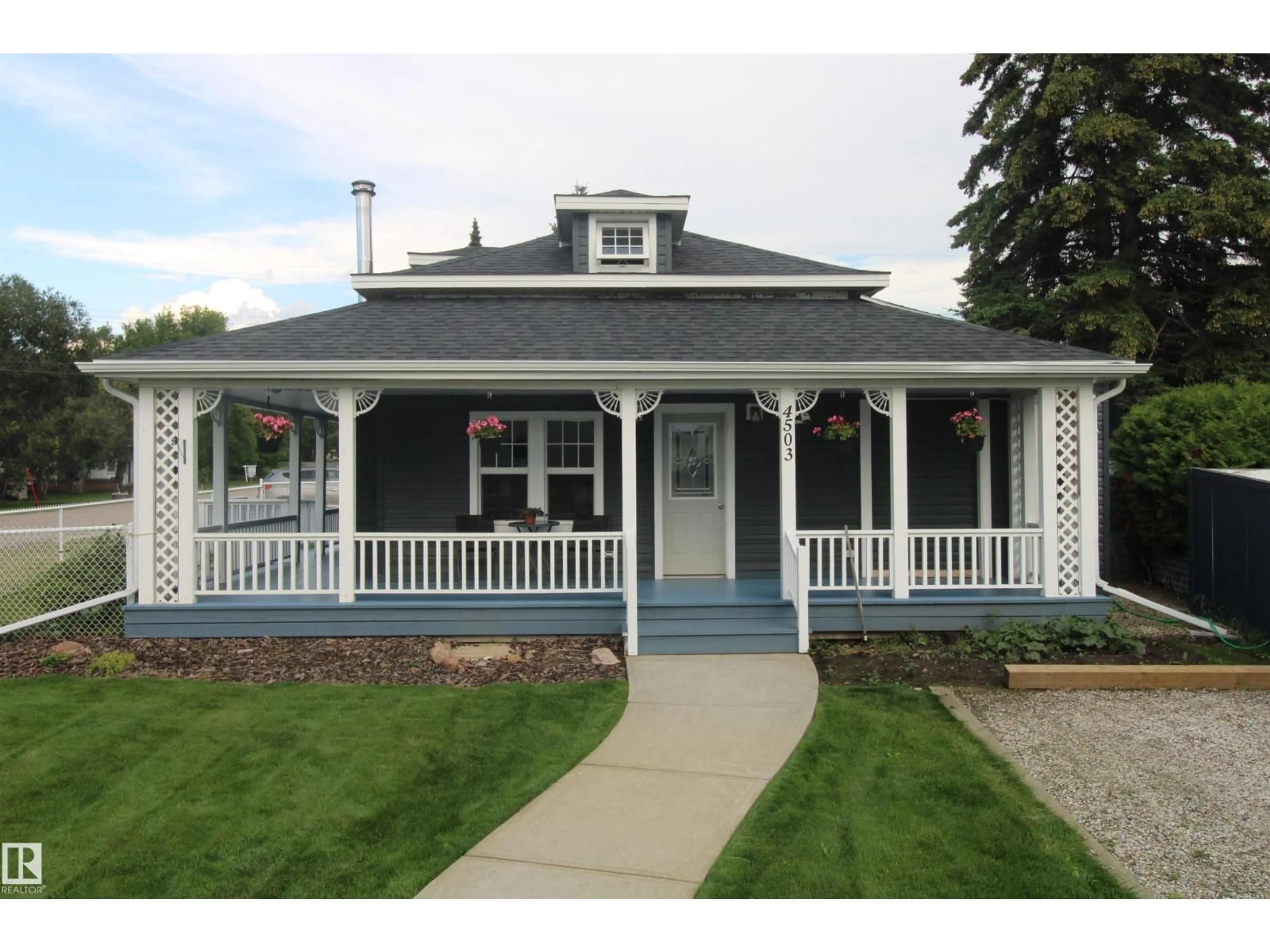 Home with vinyl exterior material, street for 4503 50 AV, Rural Lac Ste. Anne County Alberta T0E0A0