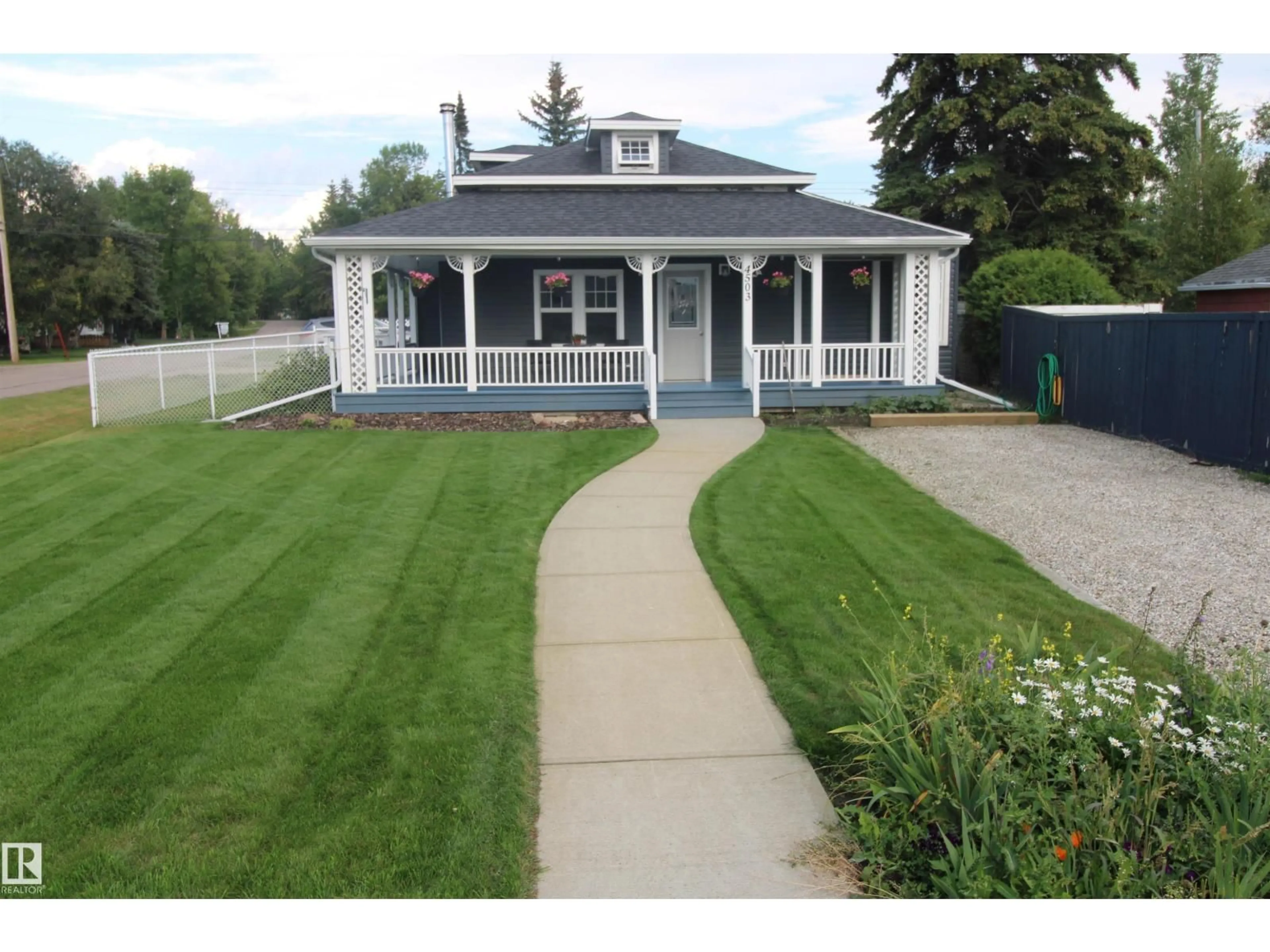 Home with vinyl exterior material, street for 4503 50 AV, Rural Lac Ste. Anne County Alberta T0E0A0