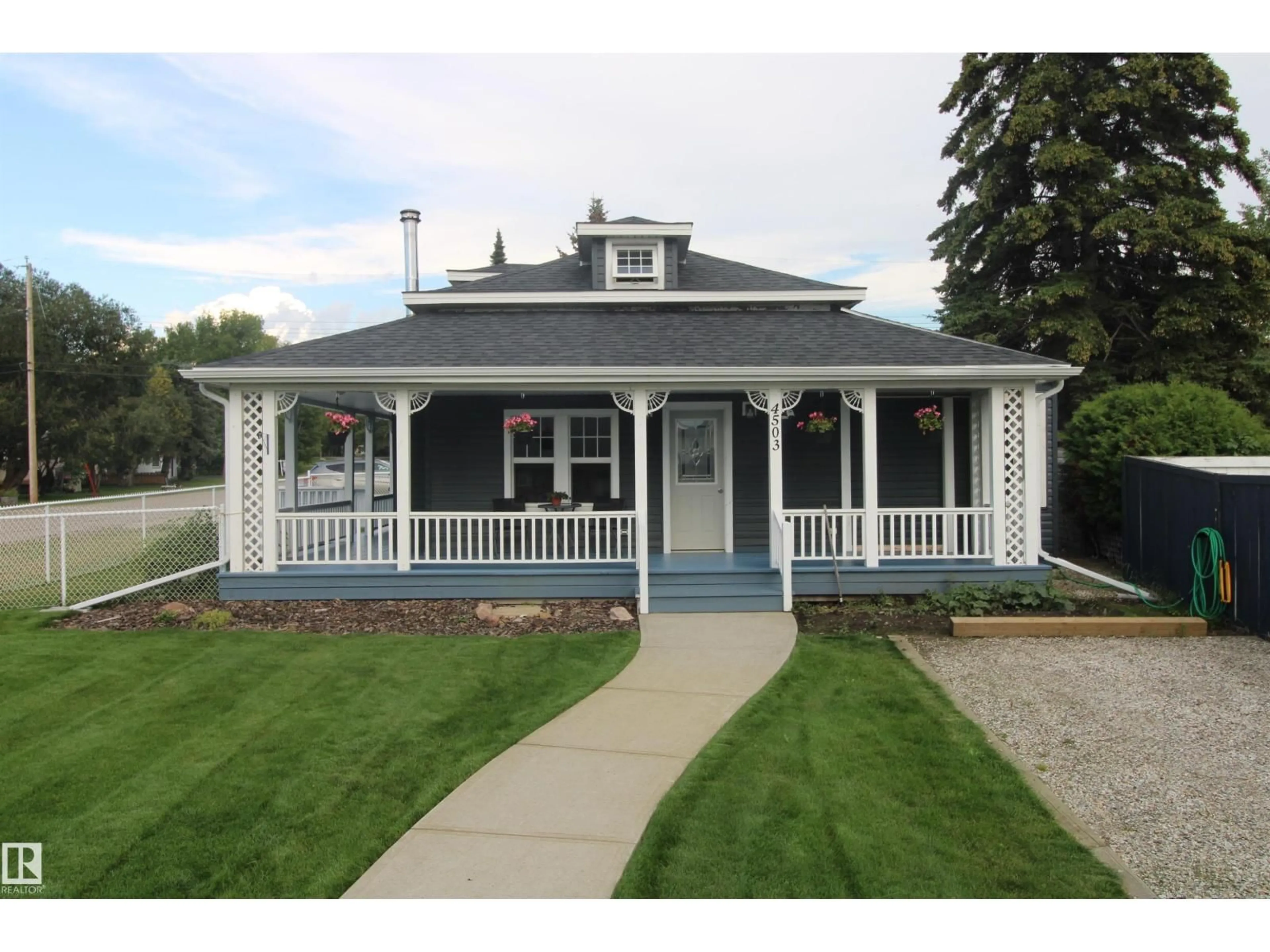Home with vinyl exterior material, street for 4503 50 AV, Rural Lac Ste. Anne County Alberta T0E0A0