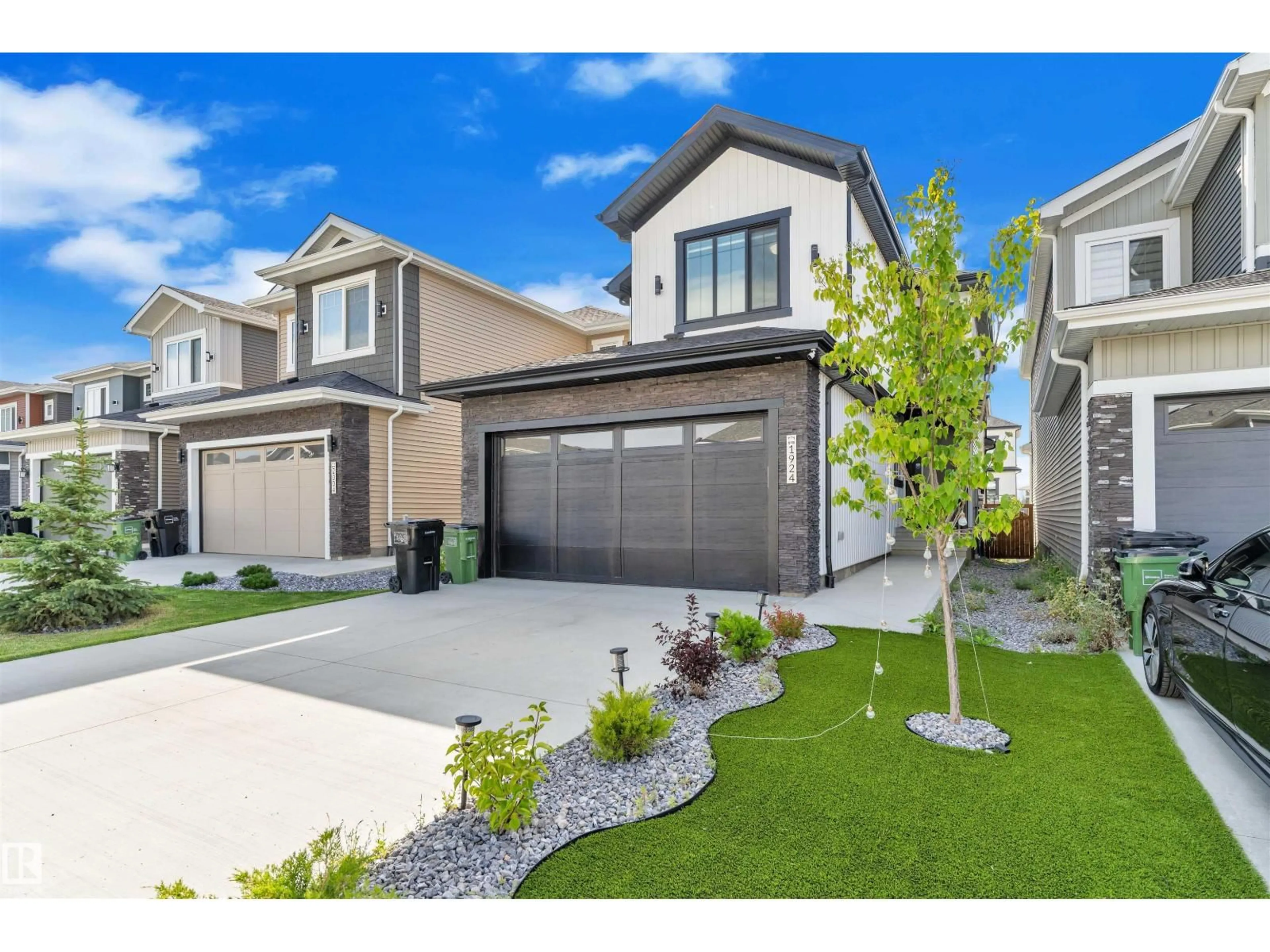 Home with vinyl exterior material, street for SW - 1924 164 ST, Edmonton Alberta T6W5J9
