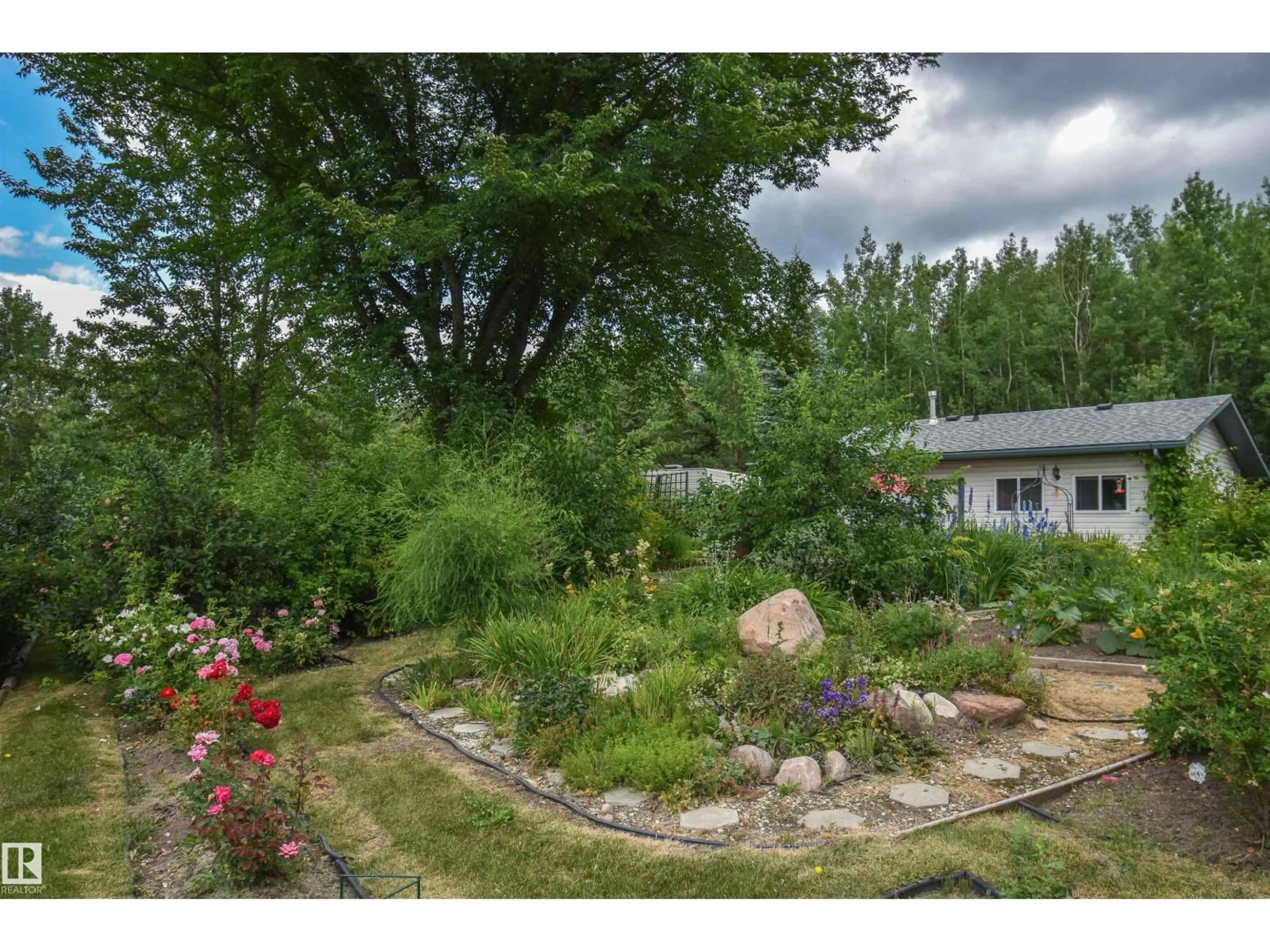 A pic from outside/outdoor area/front of a property/back of a property/a pic from drone, forest/trees view for 1 - 54429 STE. ANNE TRAIL, Rural Lac Ste. Anne County Alberta T0E0A0