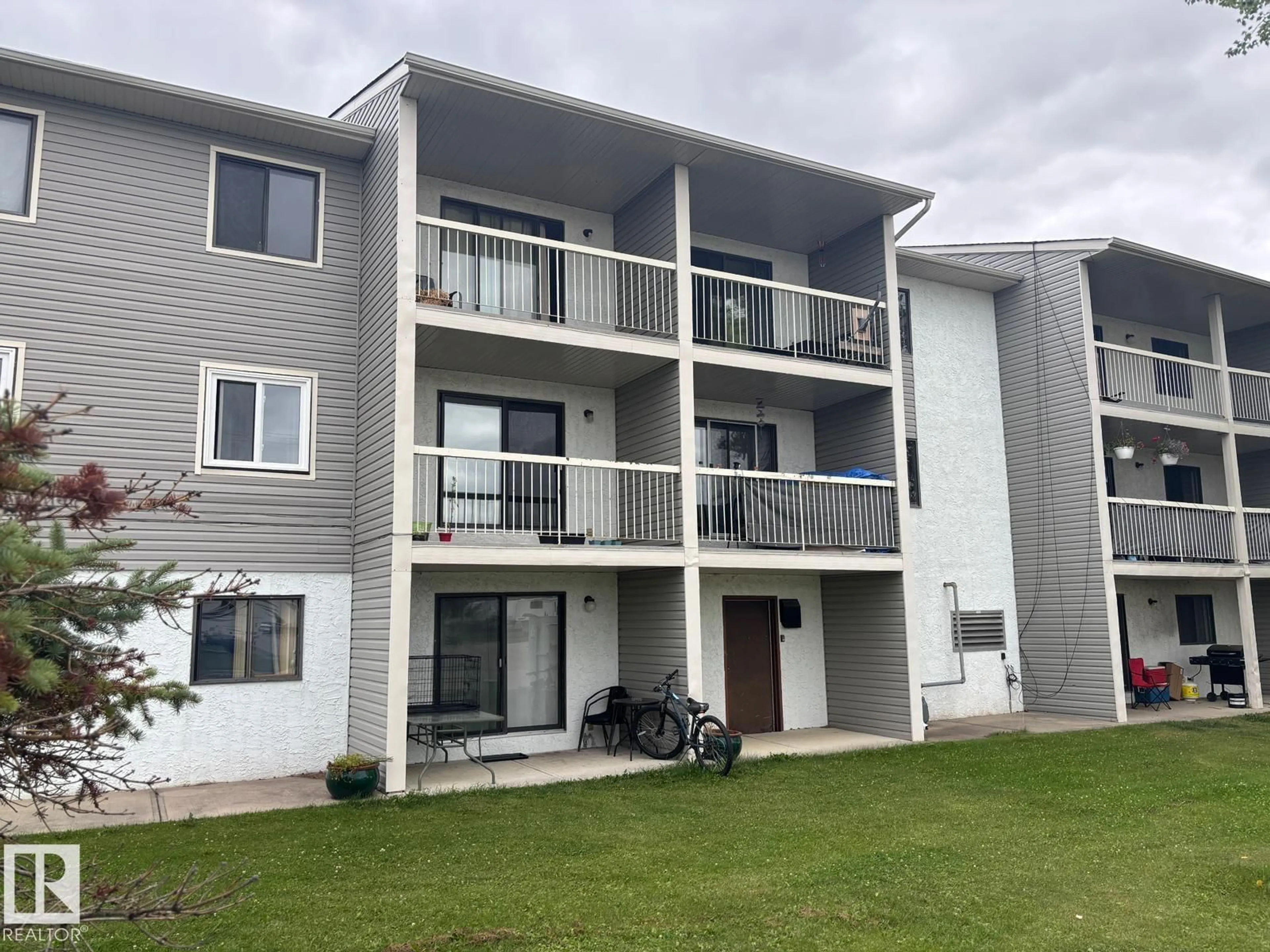 A pic from outside/outdoor area/front of a property/back of a property/a pic from drone, building for 209 - 5705 51 ST, Elk Point Alberta T0A1A0