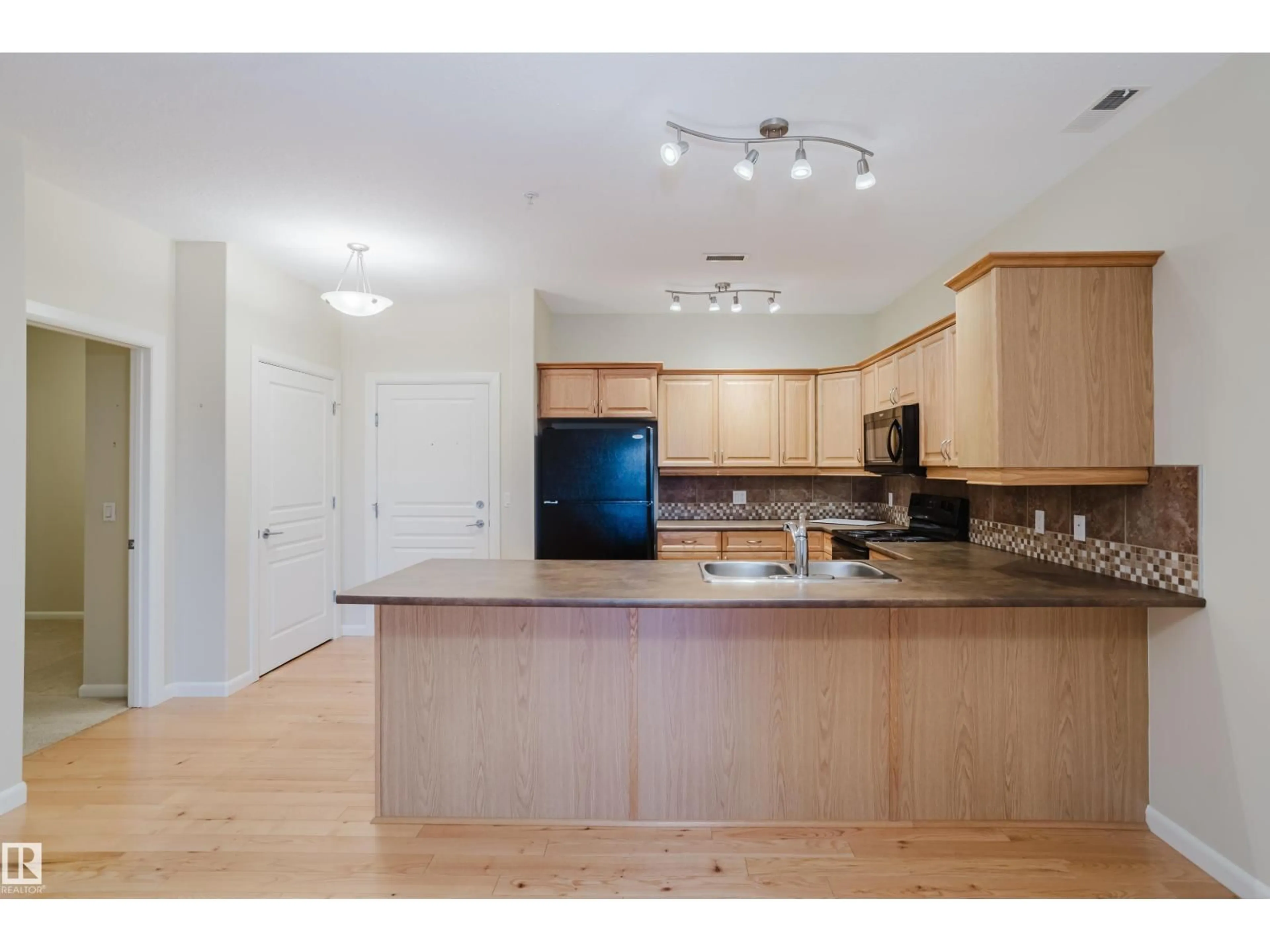 Standard kitchen, wood/laminate floor for #409 - 160 MAGRATH RD, Edmonton Alberta T6R3T7