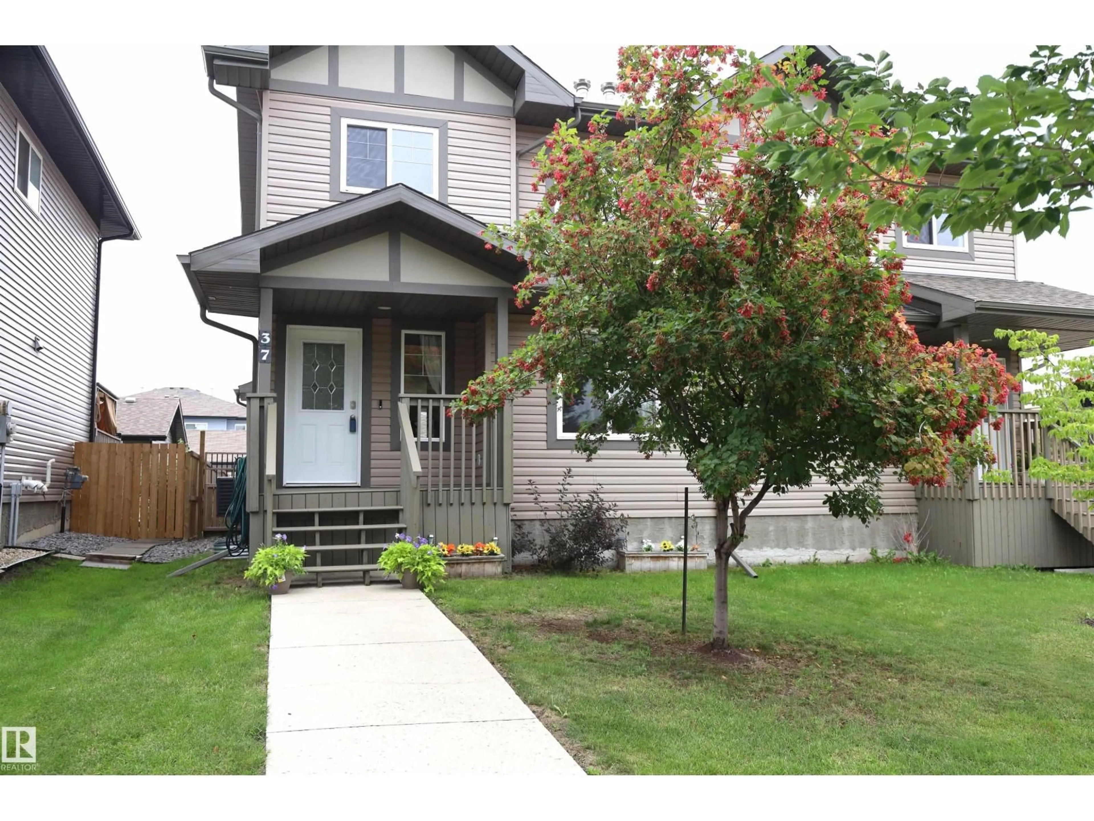 Home with vinyl exterior material, street for 37 RADCLIFFE WD, Fort Saskatchewan Alberta T8L0M6