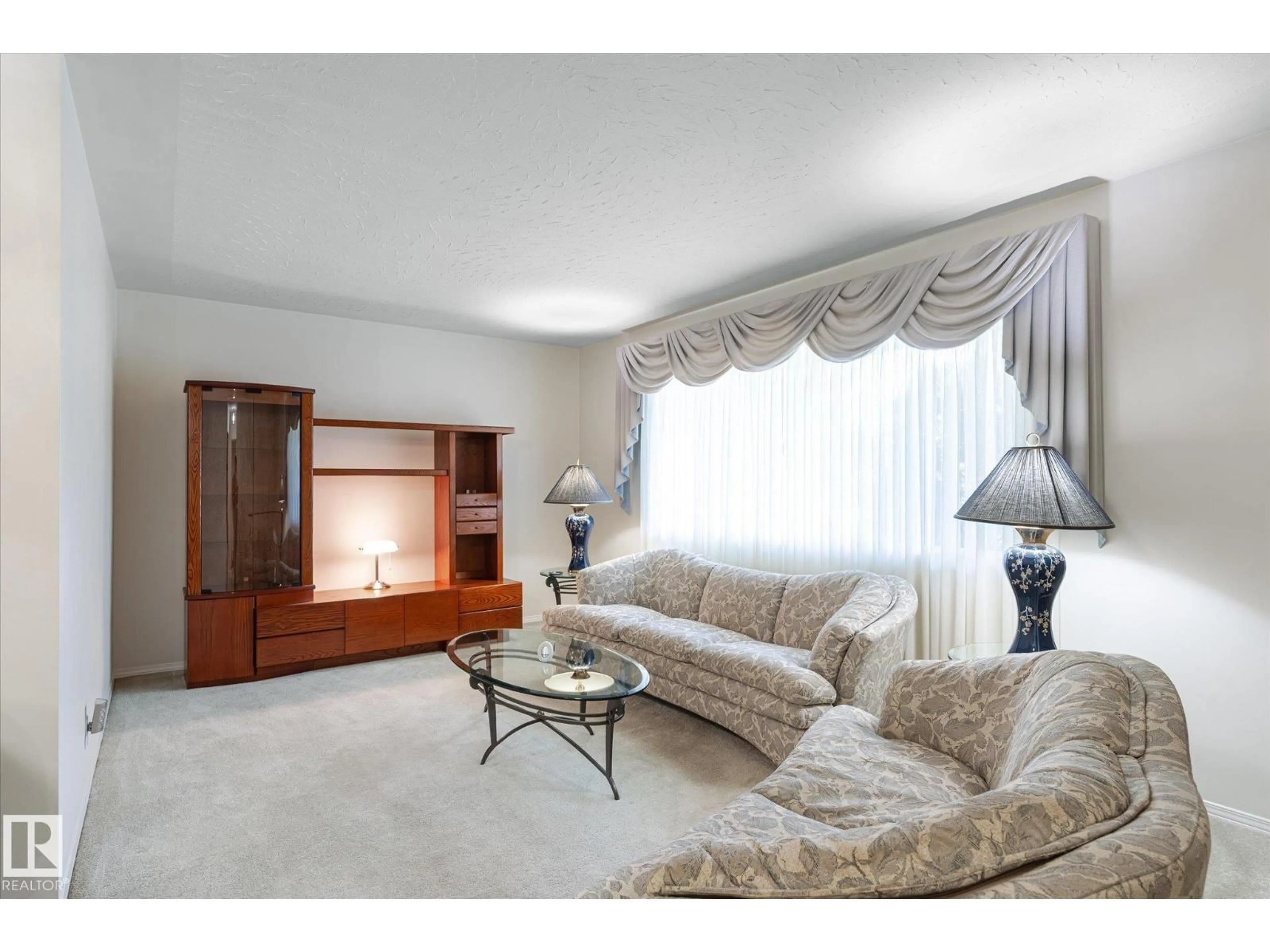 Living room with furniture, carpet floor for NW - 13407 132 AV, Edmonton Alberta T5L3R4