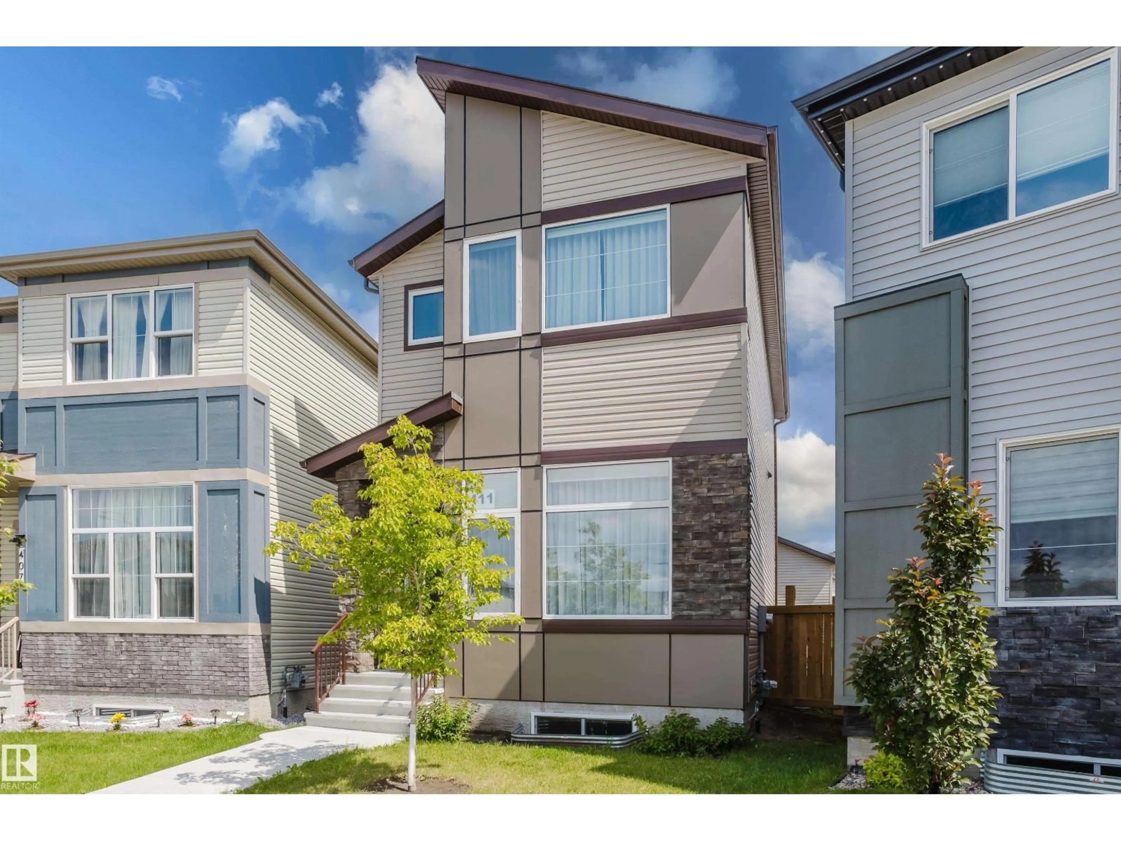Home with vinyl exterior material, street for 411 37 AV, Edmonton Alberta T6T2L7