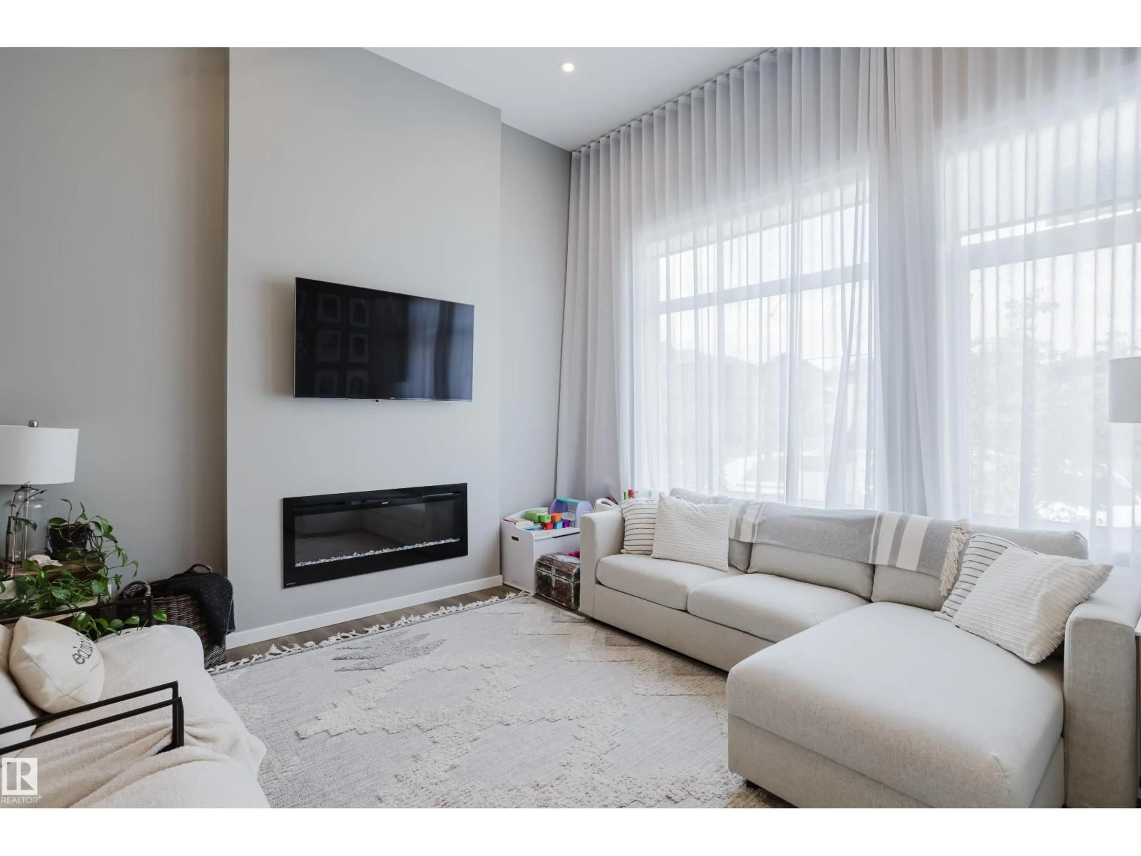 Living room with furniture, unknown for 411 37 AV, Edmonton Alberta T6T2L7