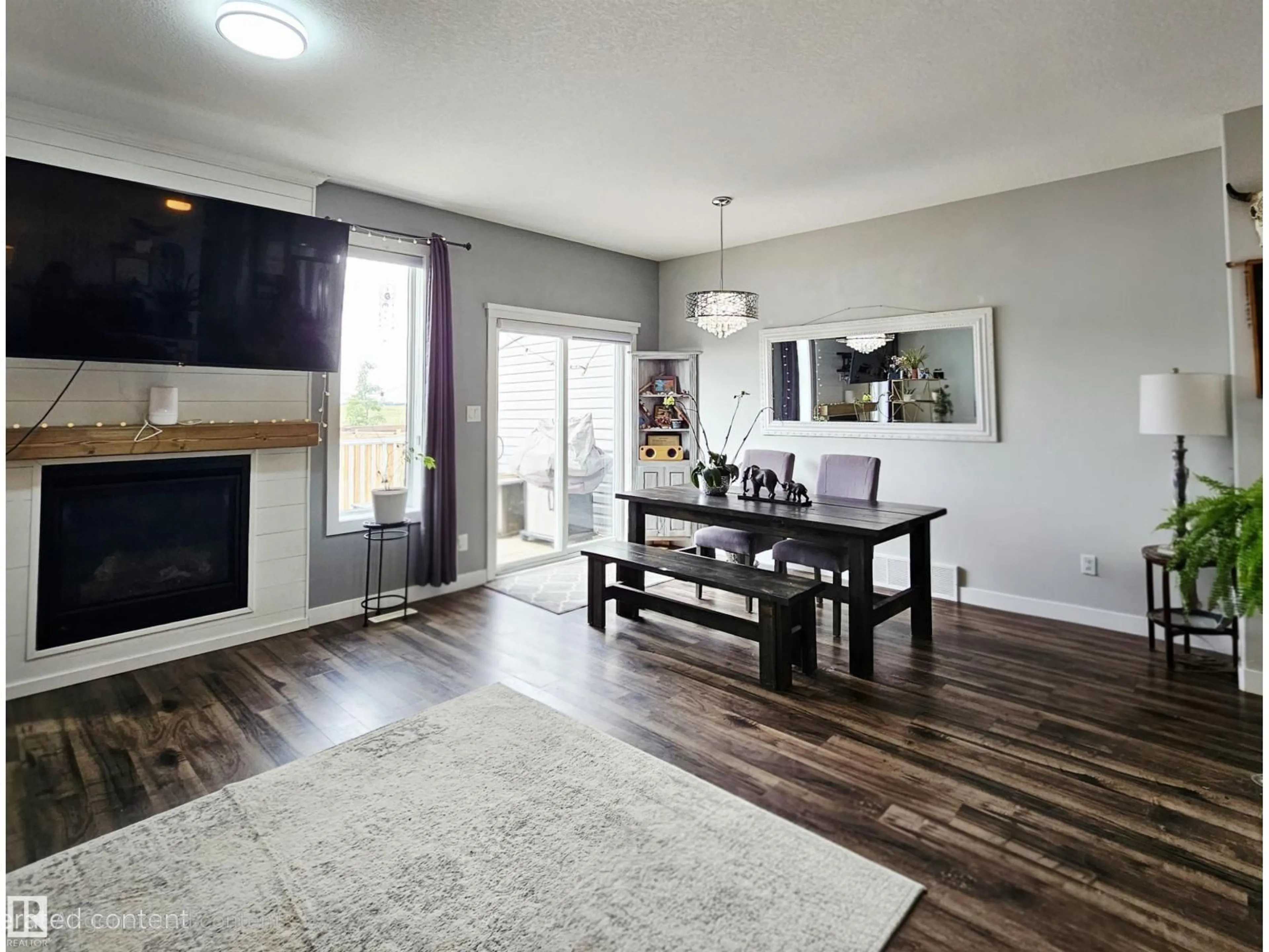 Living room with furniture, wood/laminate floor for 113 RICHMOND LI, Fort Saskatchewan Alberta T8L0S6