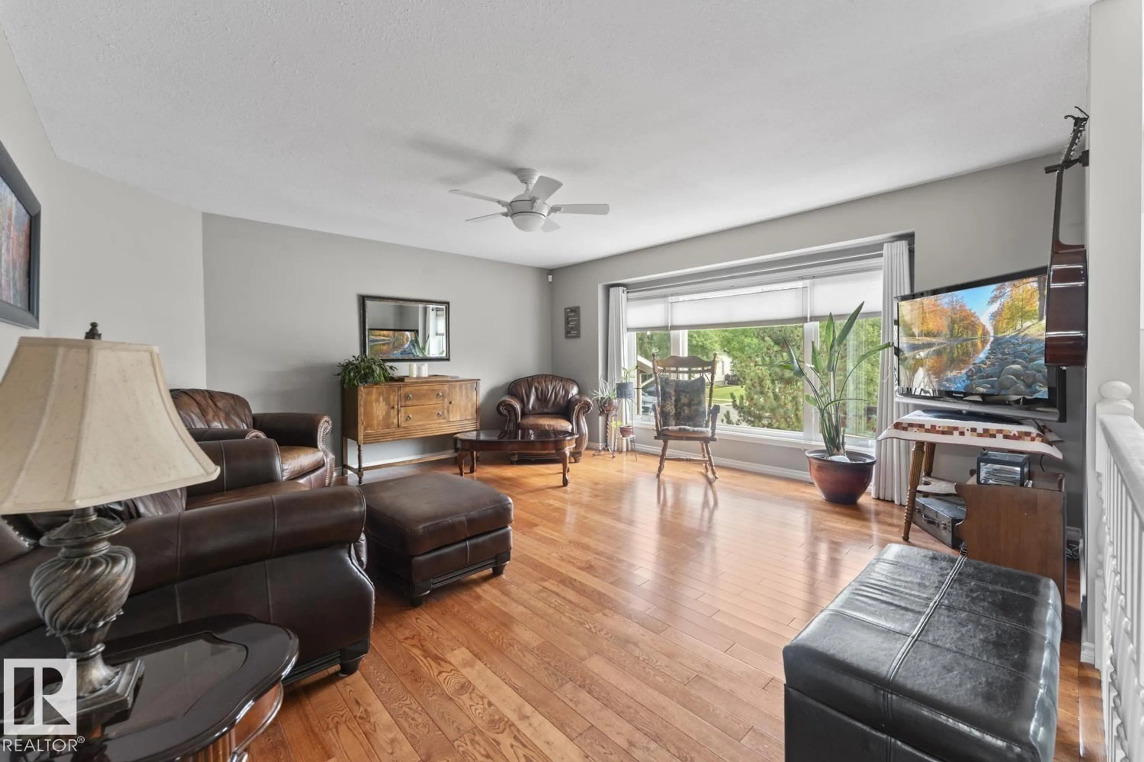 Living room with furniture, wood/laminate floor for 4115 40 AV, Bonnyville Town Alberta T9N1T9