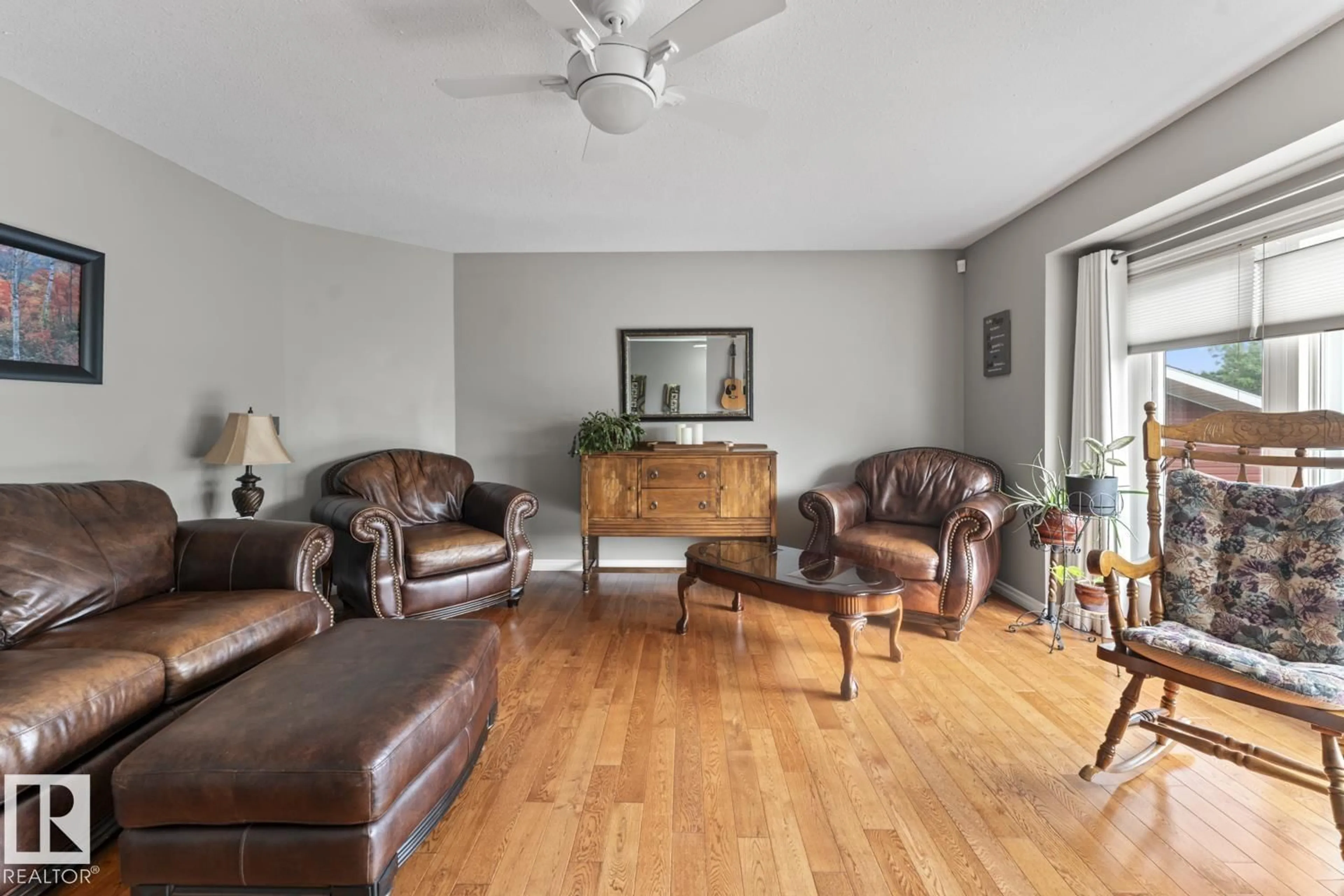 Living room with furniture, wood/laminate floor for 4115 40 AV, Bonnyville Town Alberta T9N1T9