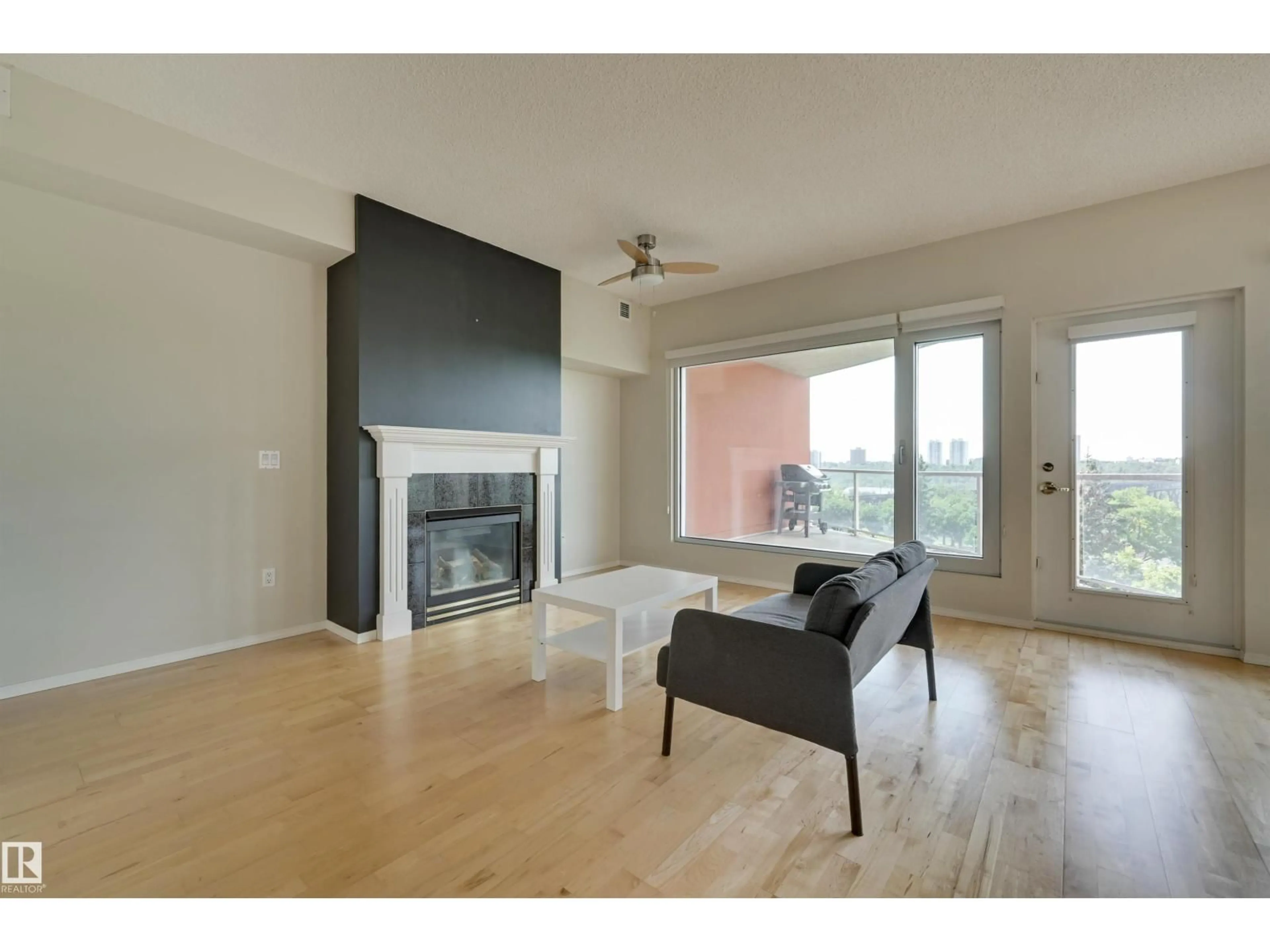Living room with furniture, wood/laminate floor for 501 - 9708 110 ST NW, Edmonton Alberta T5K2W3