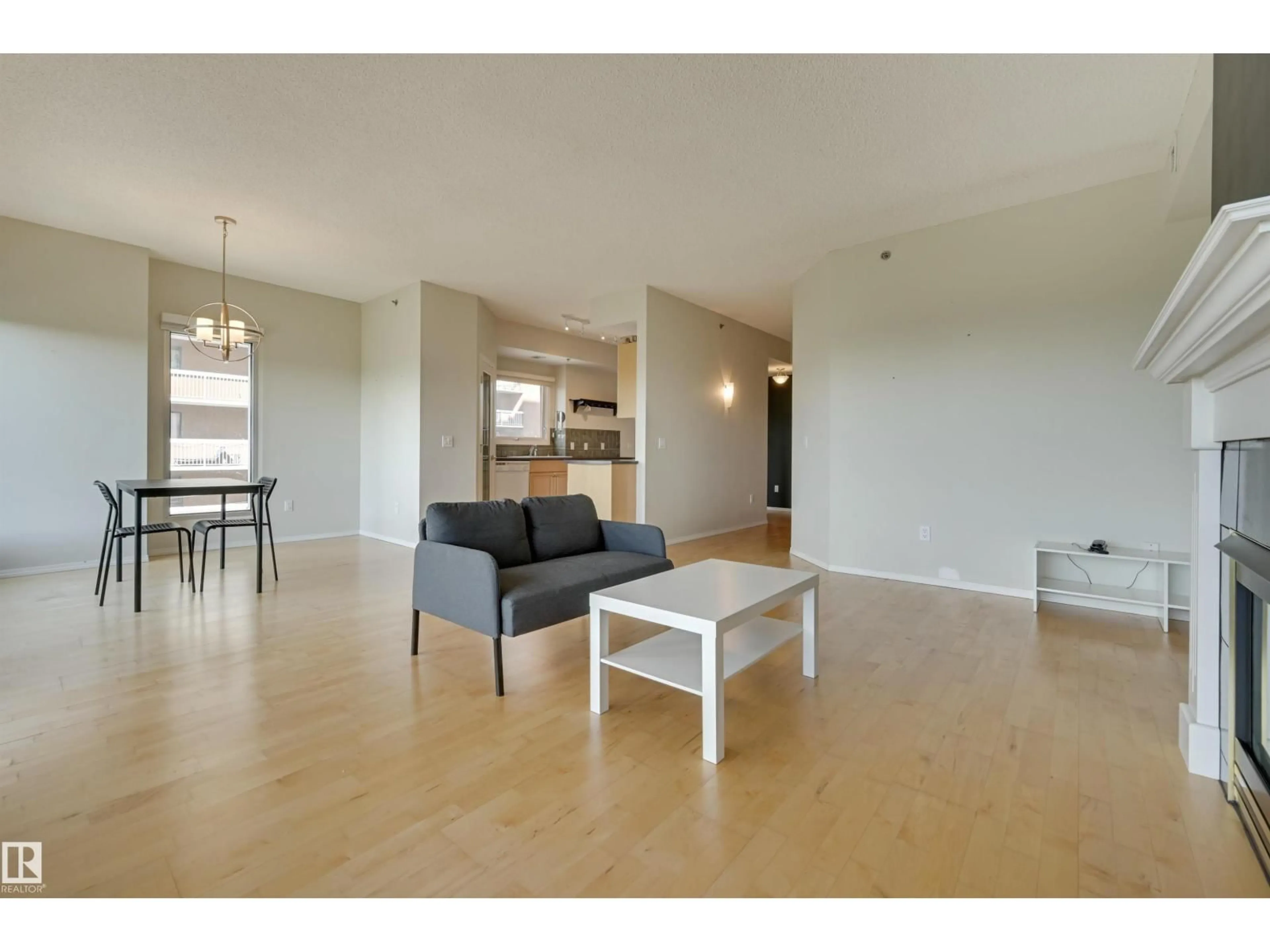 Living room with furniture, wood/laminate floor for 501 - 9708 110 ST NW, Edmonton Alberta T5K2W3