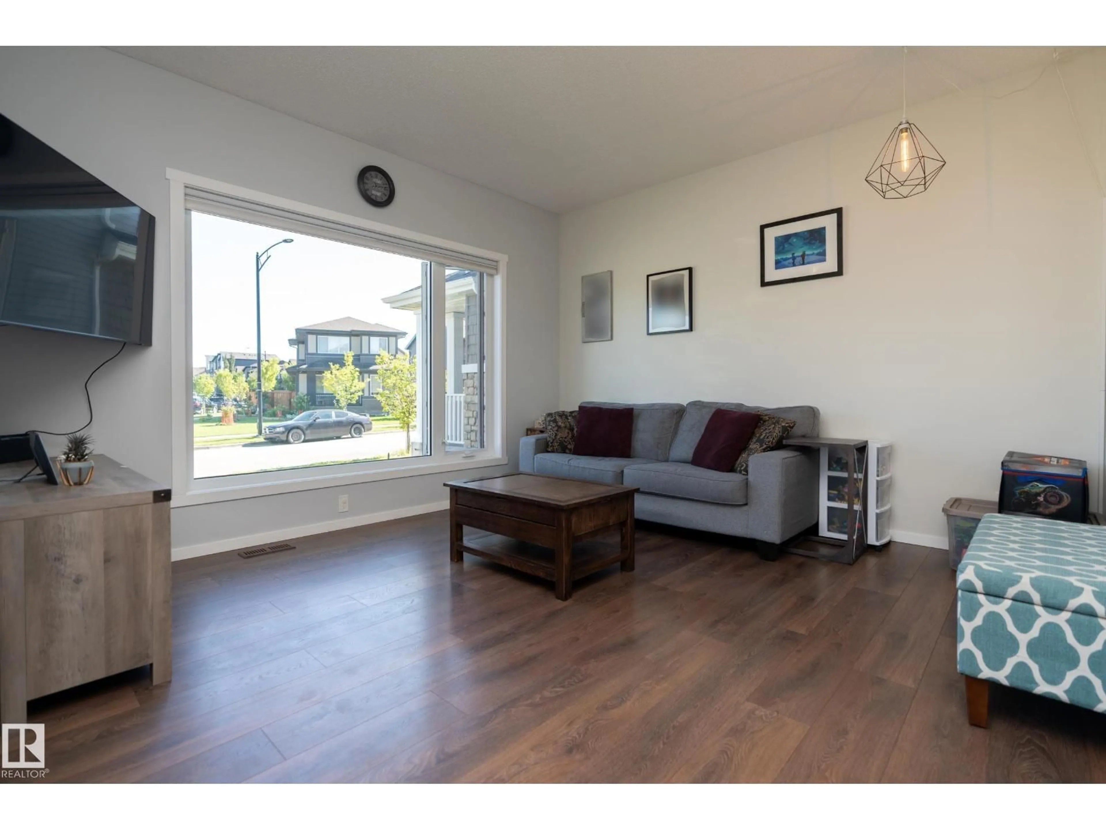 Living room with furniture, wood/laminate floor for SW - 2604 PRICE CM, Edmonton Alberta T6W3P9