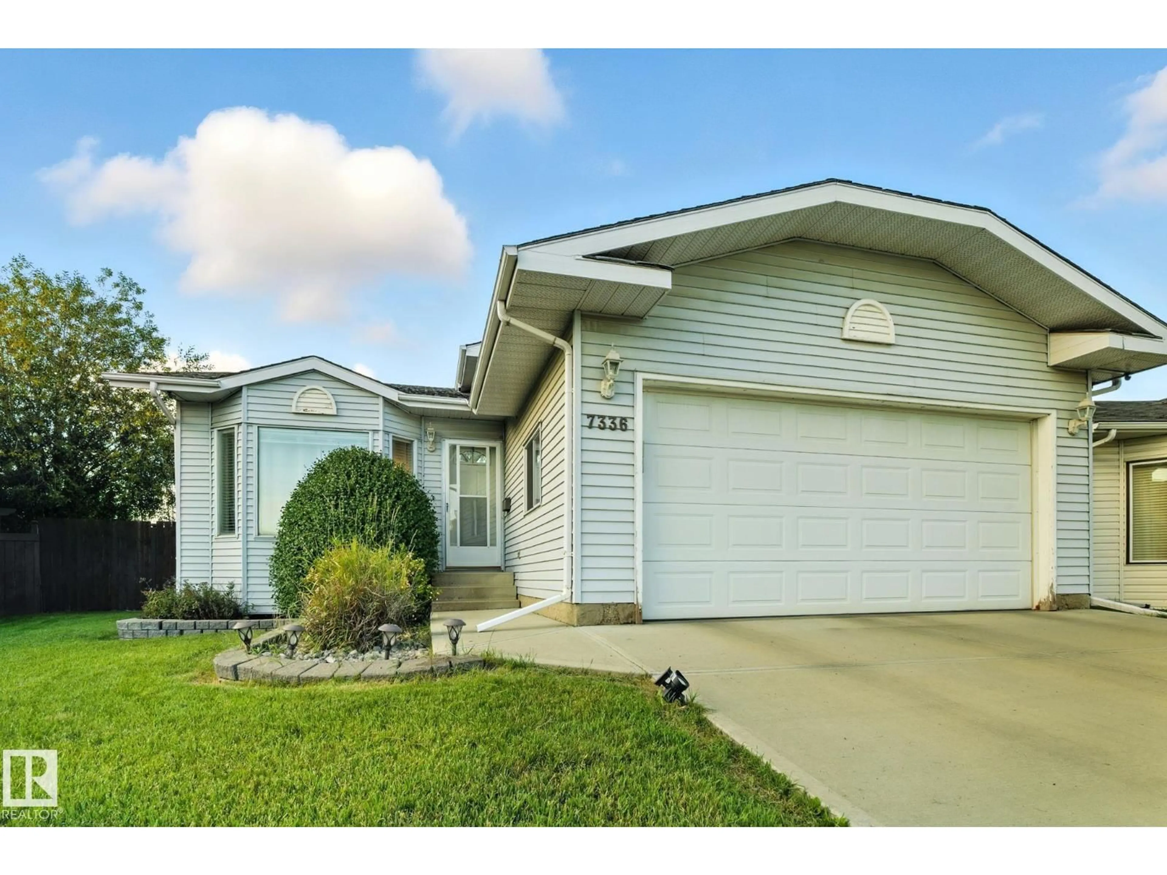 Home with vinyl exterior material, street for NW - 7336 152C AV, Edmonton Alberta T5C3M8