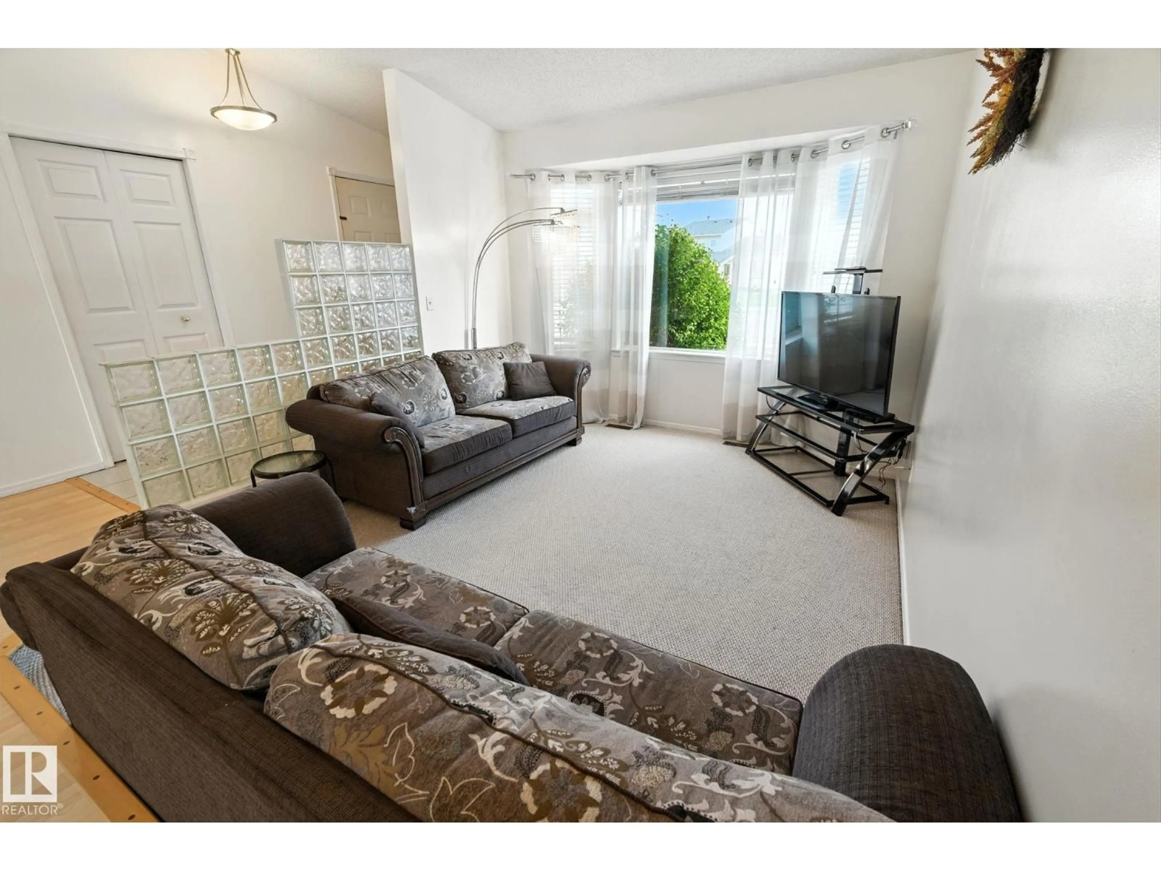 Living room with furniture, unknown for NW - 7336 152C AV, Edmonton Alberta T5C3M8