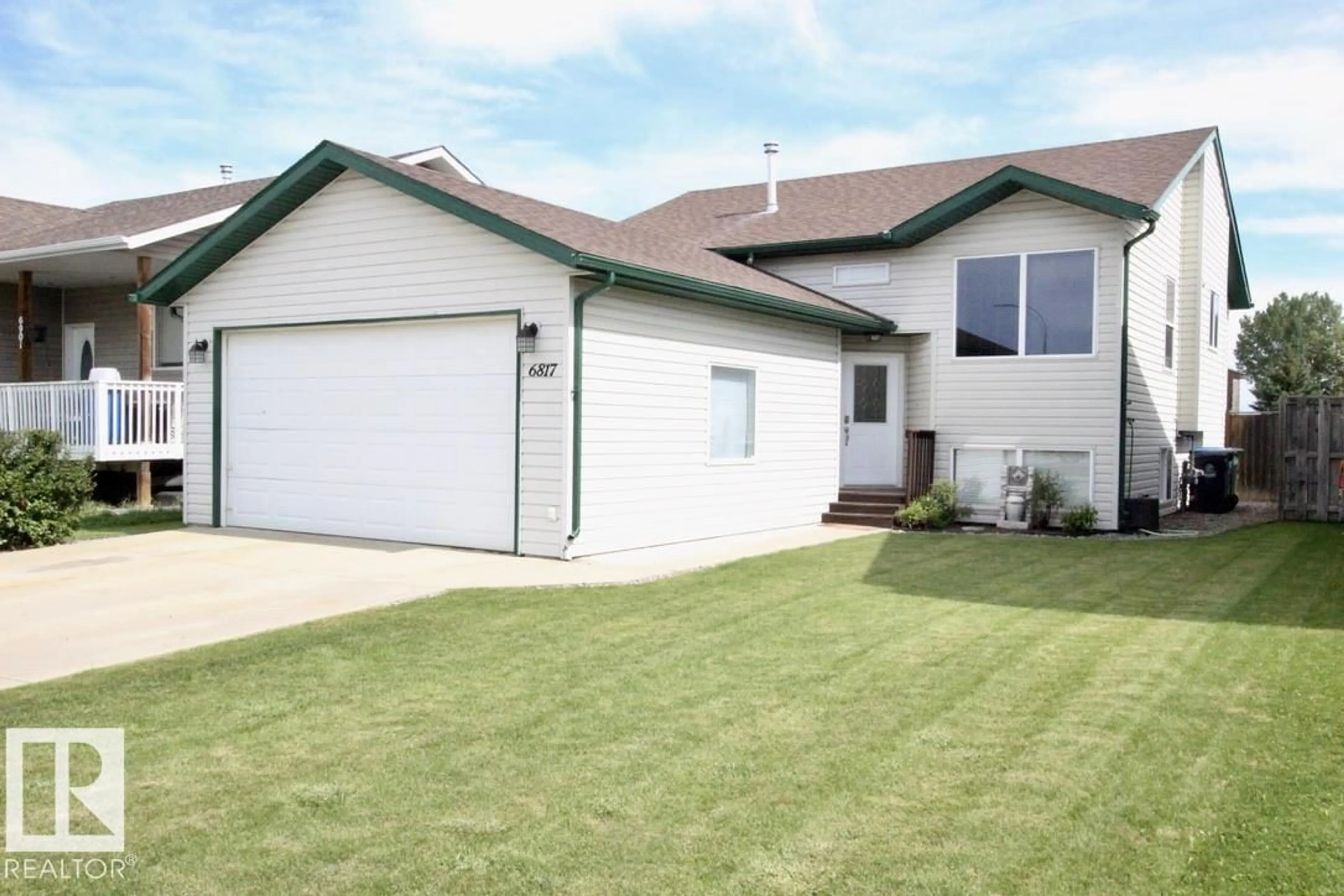 Home with vinyl exterior material, street for 6817 58 ST, Rocky Mountain House Alberta T4T1V8