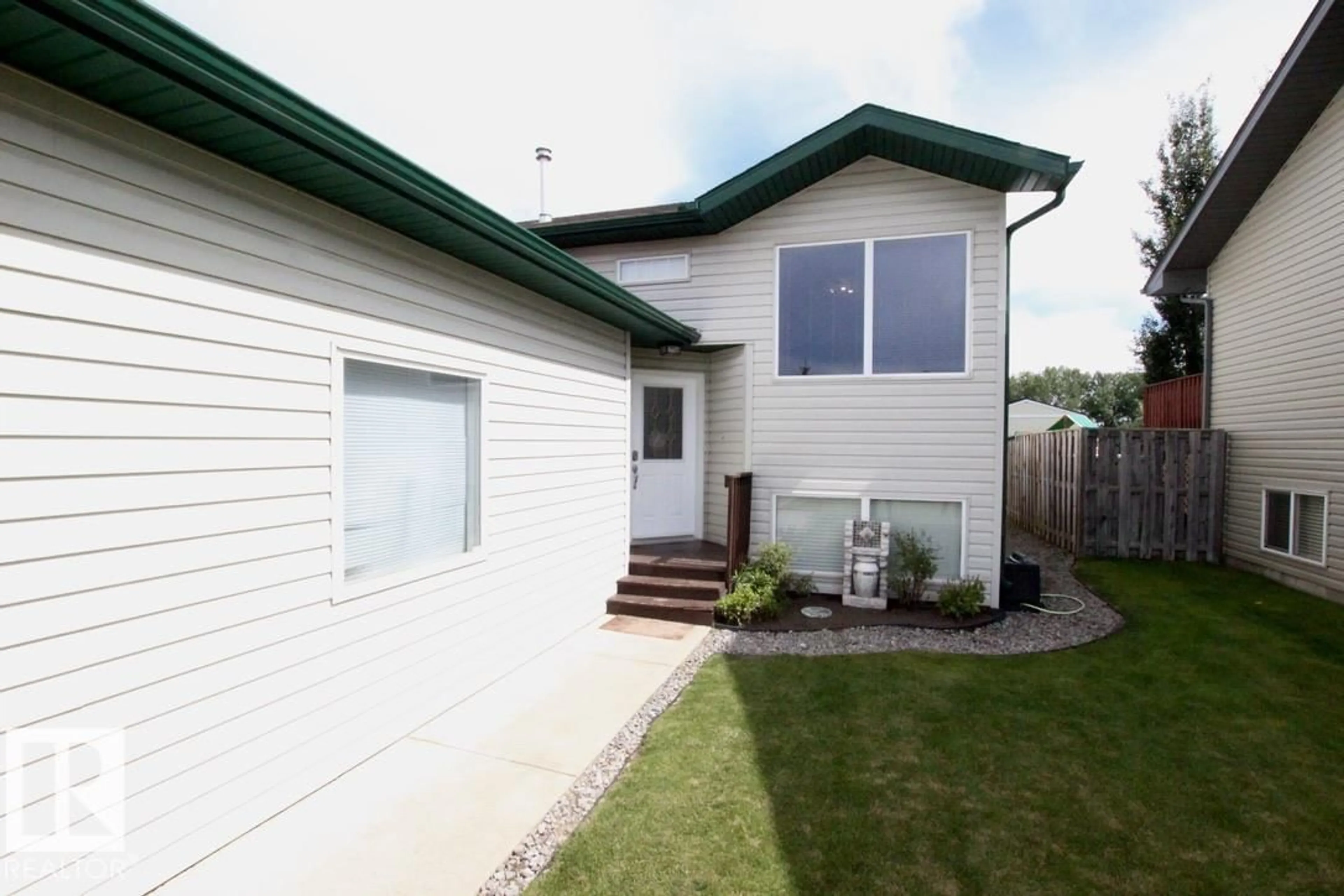Home with vinyl exterior material, street for 6817 58 ST, Rocky Mountain House Alberta T4T1V8