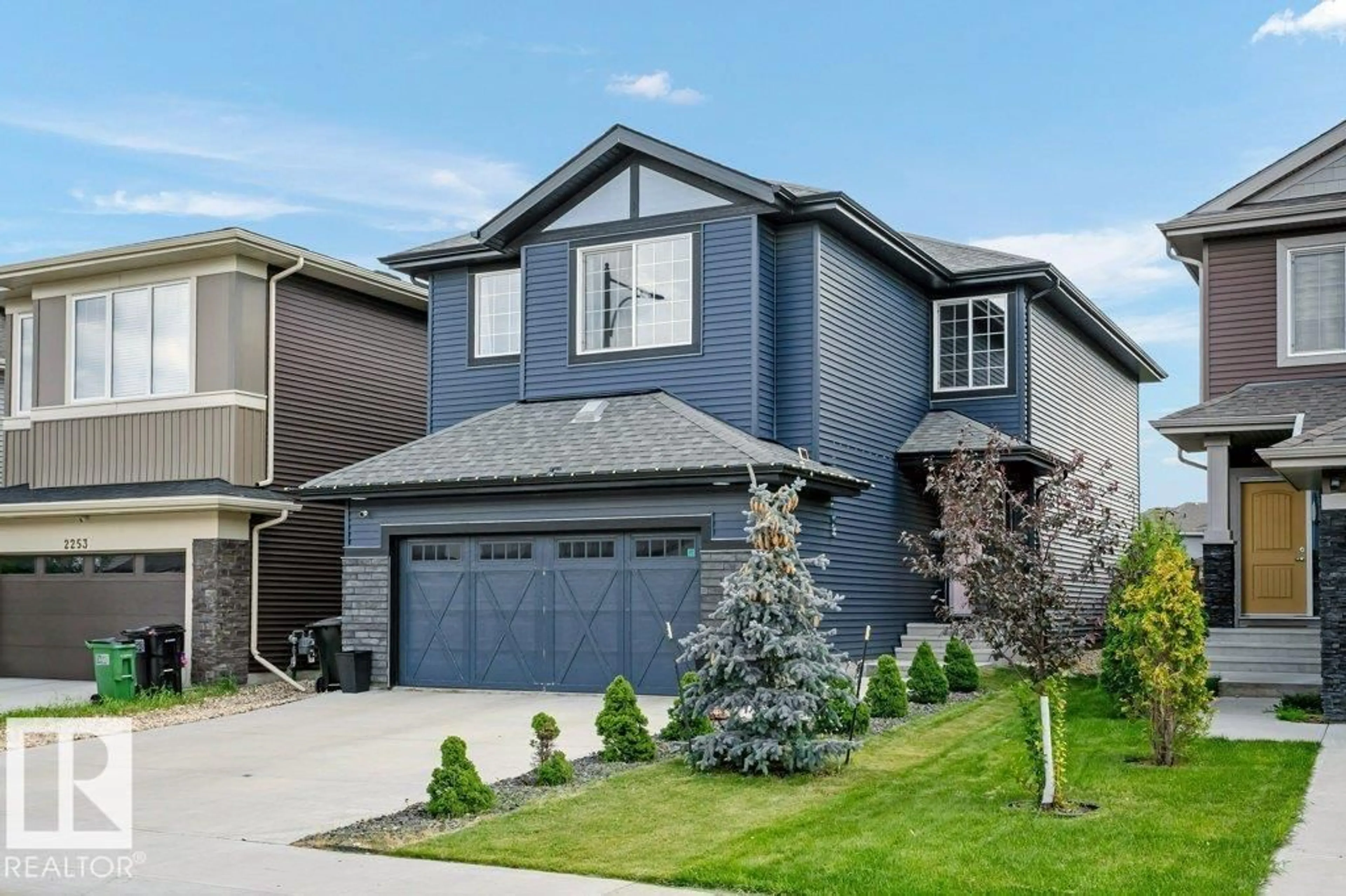 Home with vinyl exterior material, street for SW - 2257 57 ST, Edmonton Alberta T6X2P3