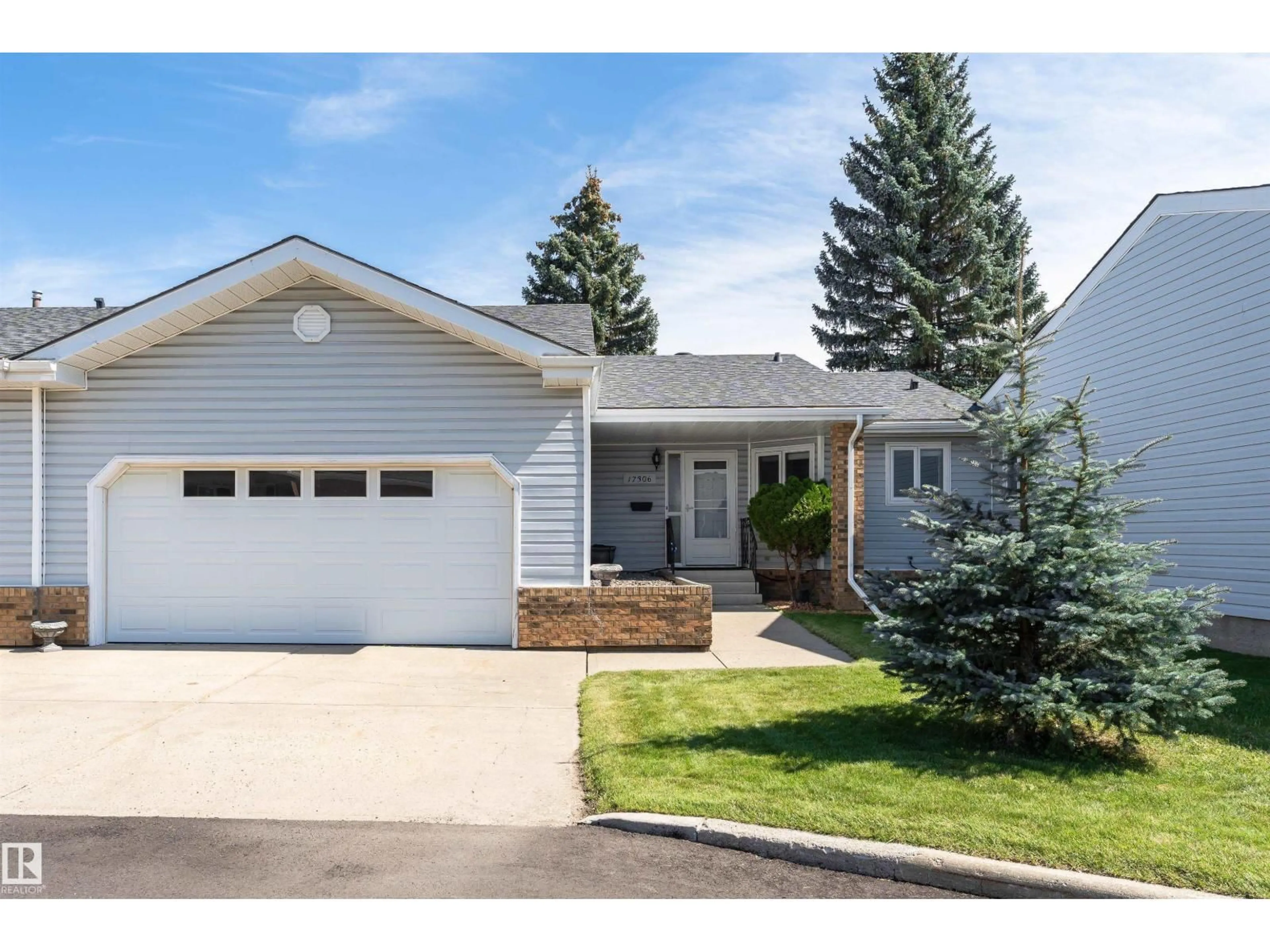 Home with vinyl exterior material, street for 17306 CALLINGWOOD RD, Edmonton Alberta T5T5P1