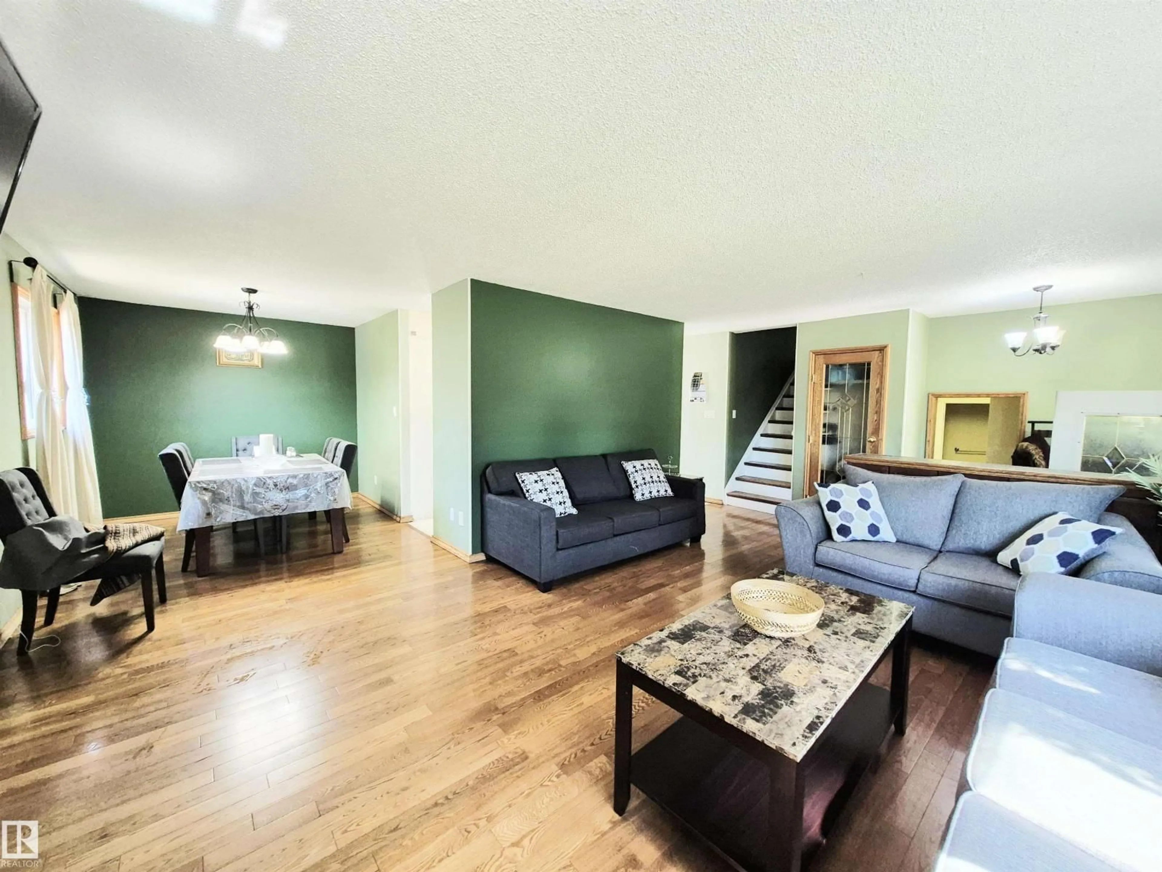 Living room with furniture, wood/laminate floor for 11404 161 AV, Edmonton Alberta T5X2L1