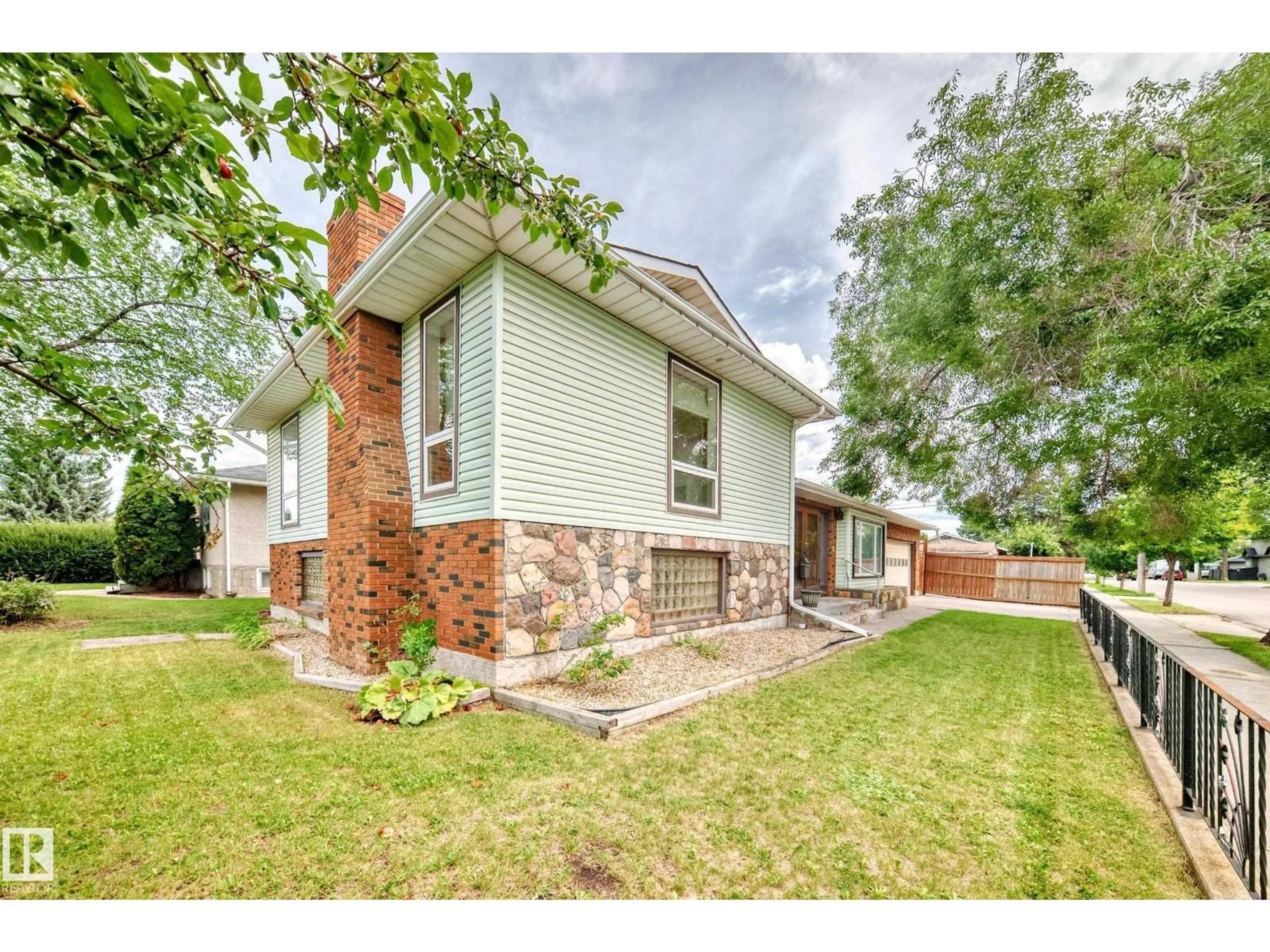 Home with brick exterior material, street for 13316 129 AV, Edmonton Alberta T5L3K2