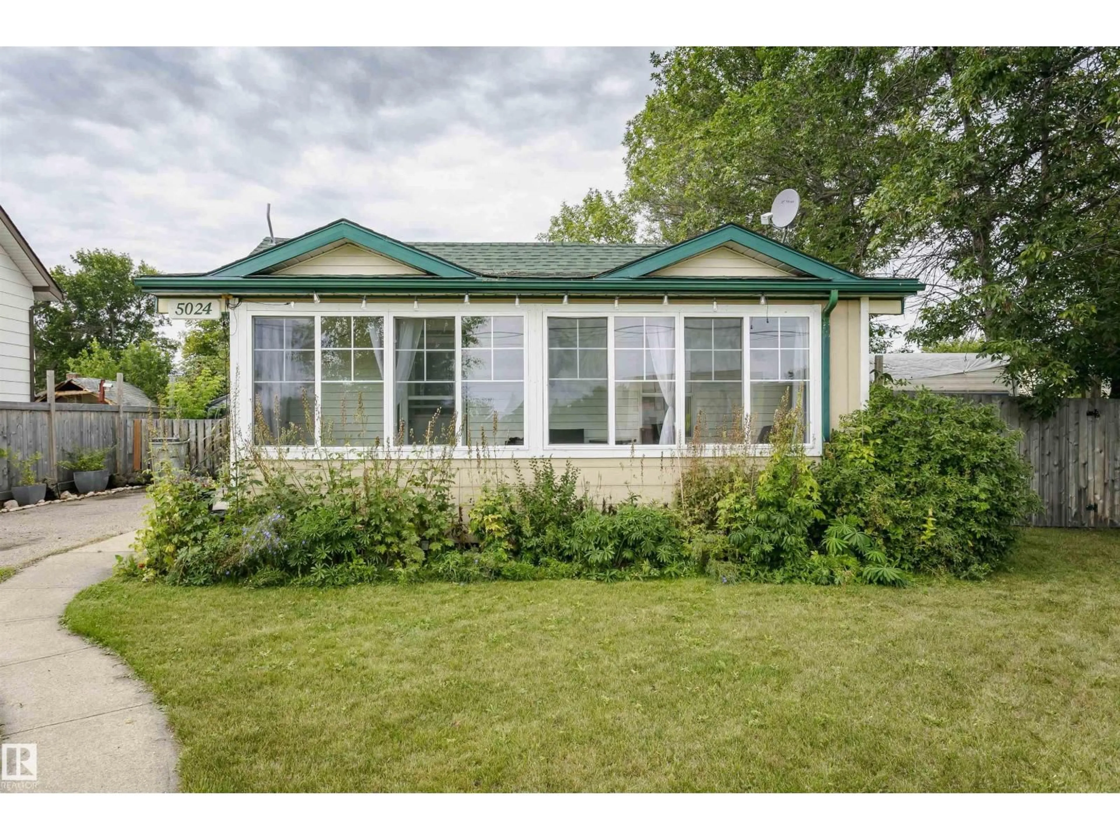 Home with vinyl exterior material, street for 5024 46 ST, Legal Alberta T0G1L0