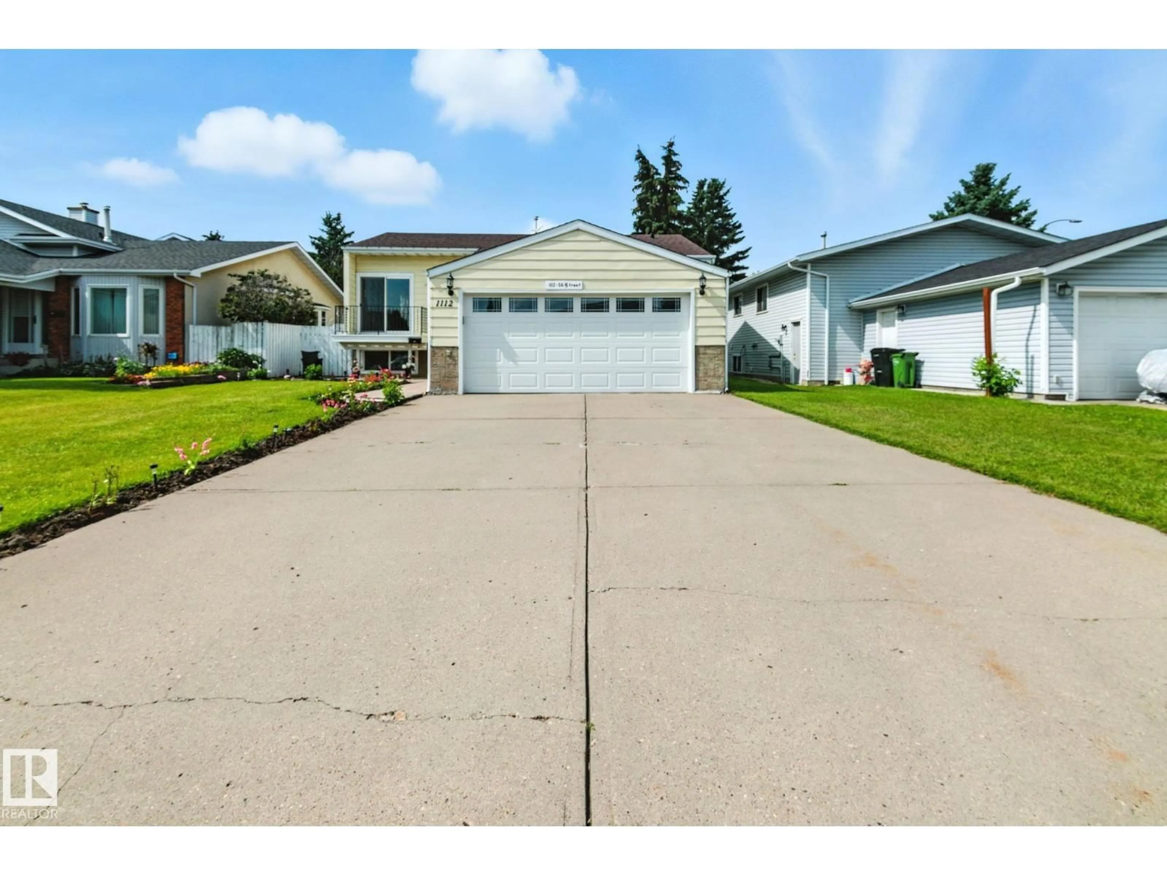 Home with vinyl exterior material, street for 1112 56 ST, Edmonton Alberta T6L1Y3