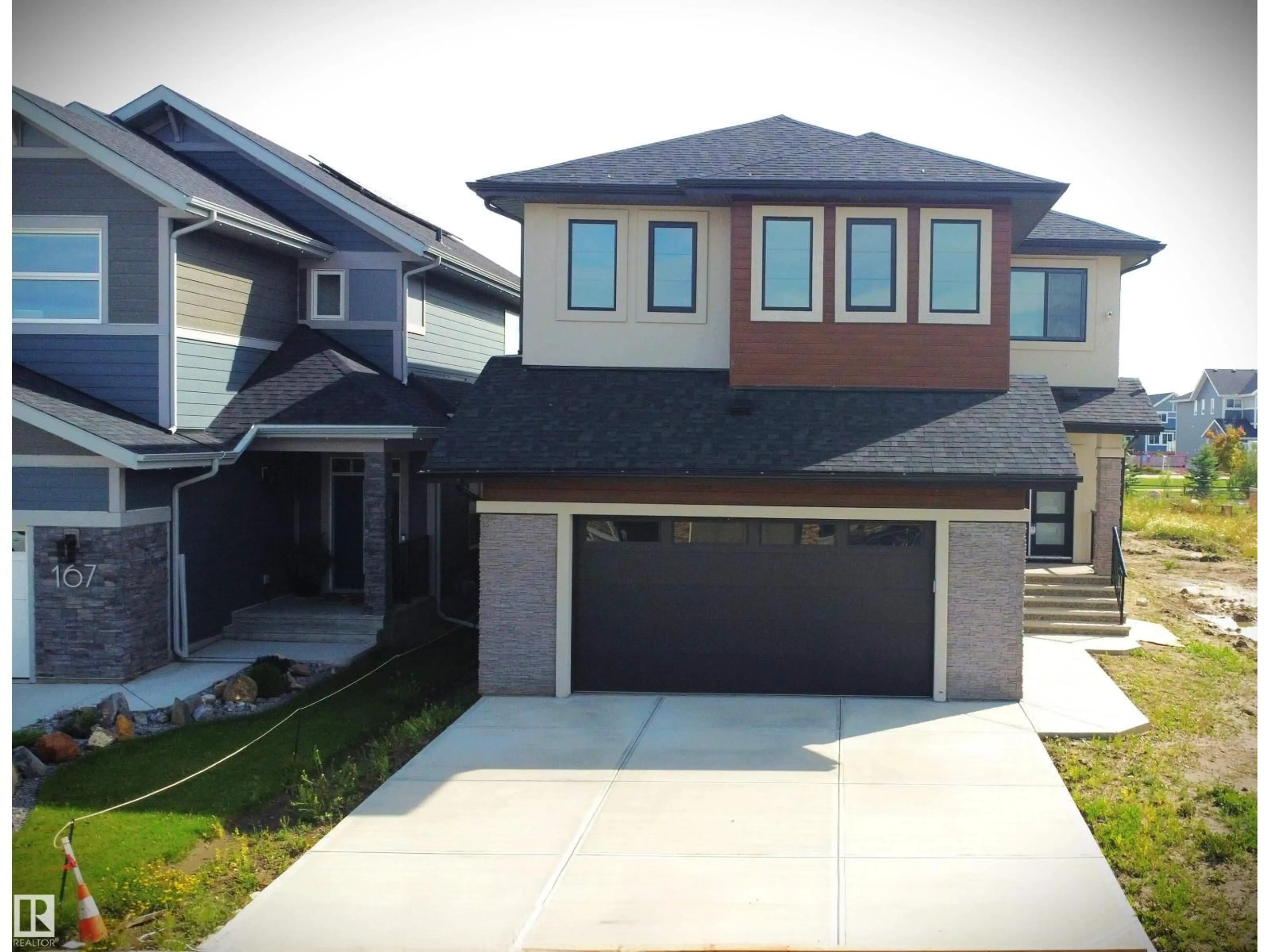 Home with vinyl exterior material, street for 165 EDGEWATER CIR, Leduc Alberta T9E1K5