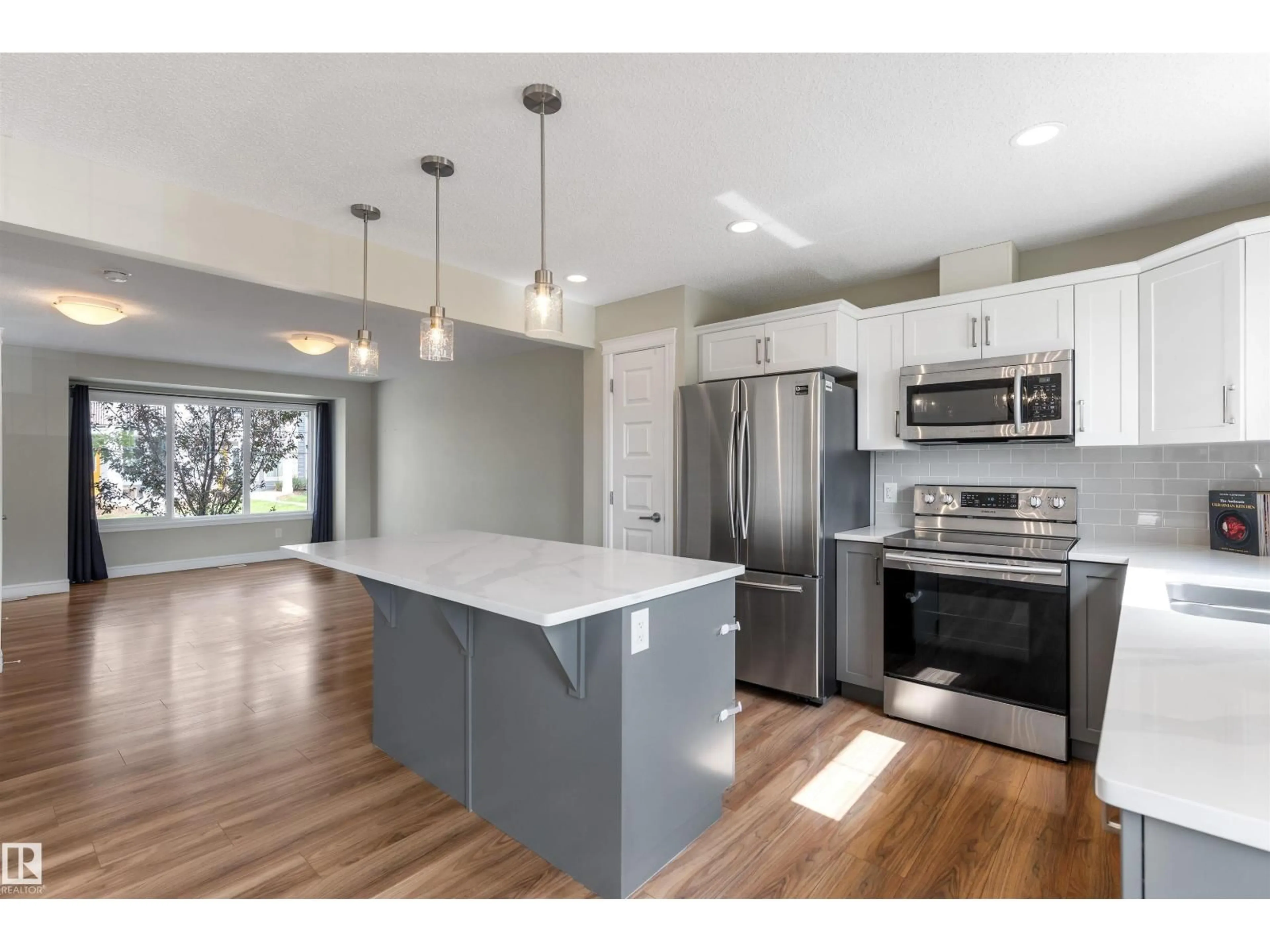 Open concept kitchen, wood/laminate floor for #4 - 330 BULYEA RD, Edmonton Alberta T6R0W8