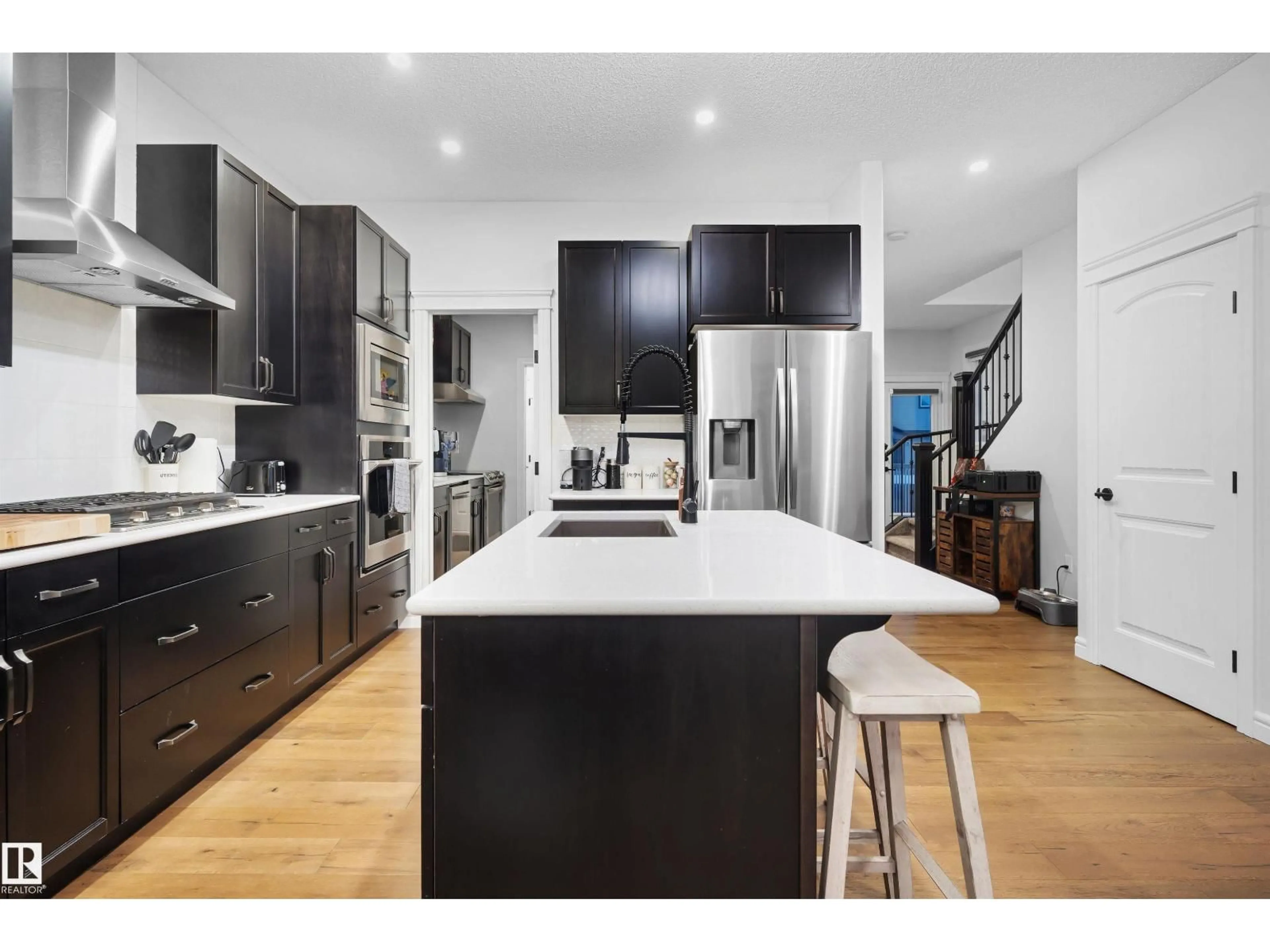 Open concept kitchen, wood/laminate floor for 449 CONROY CR, Edmonton Alberta T6W5A9