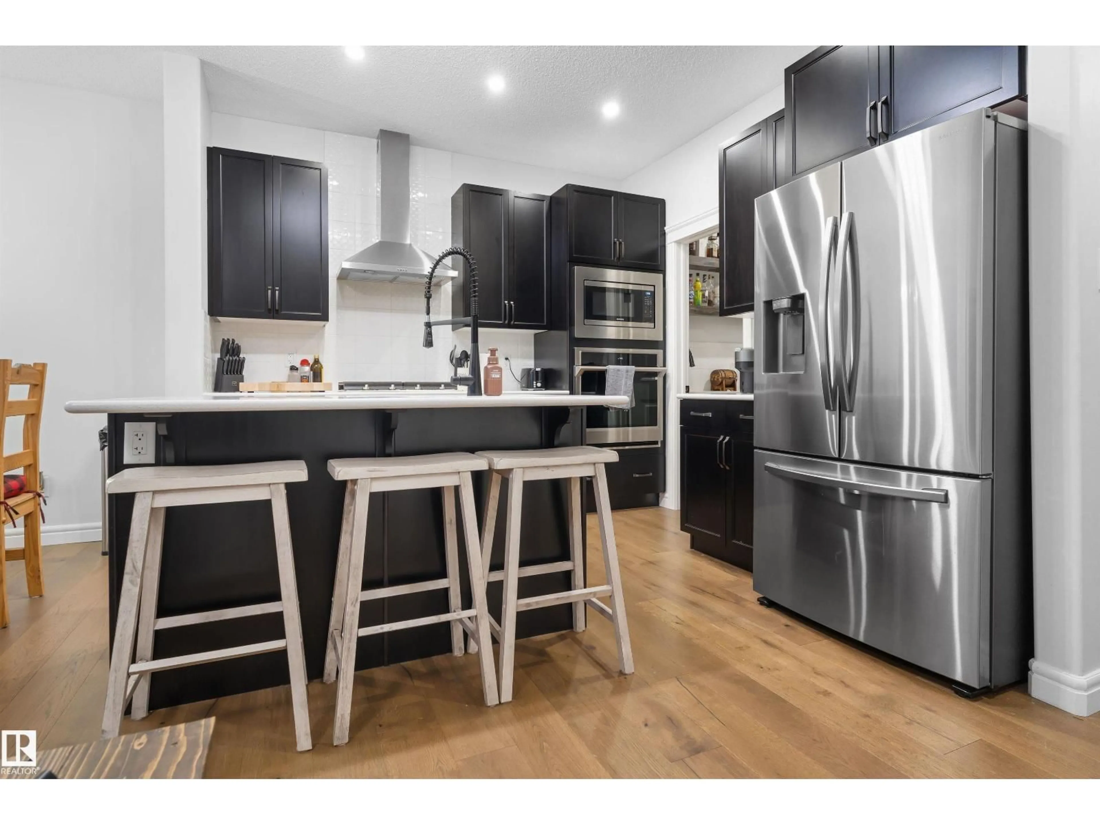 Open concept kitchen, wood/laminate floor for 449 CONROY CR, Edmonton Alberta T6W5A9