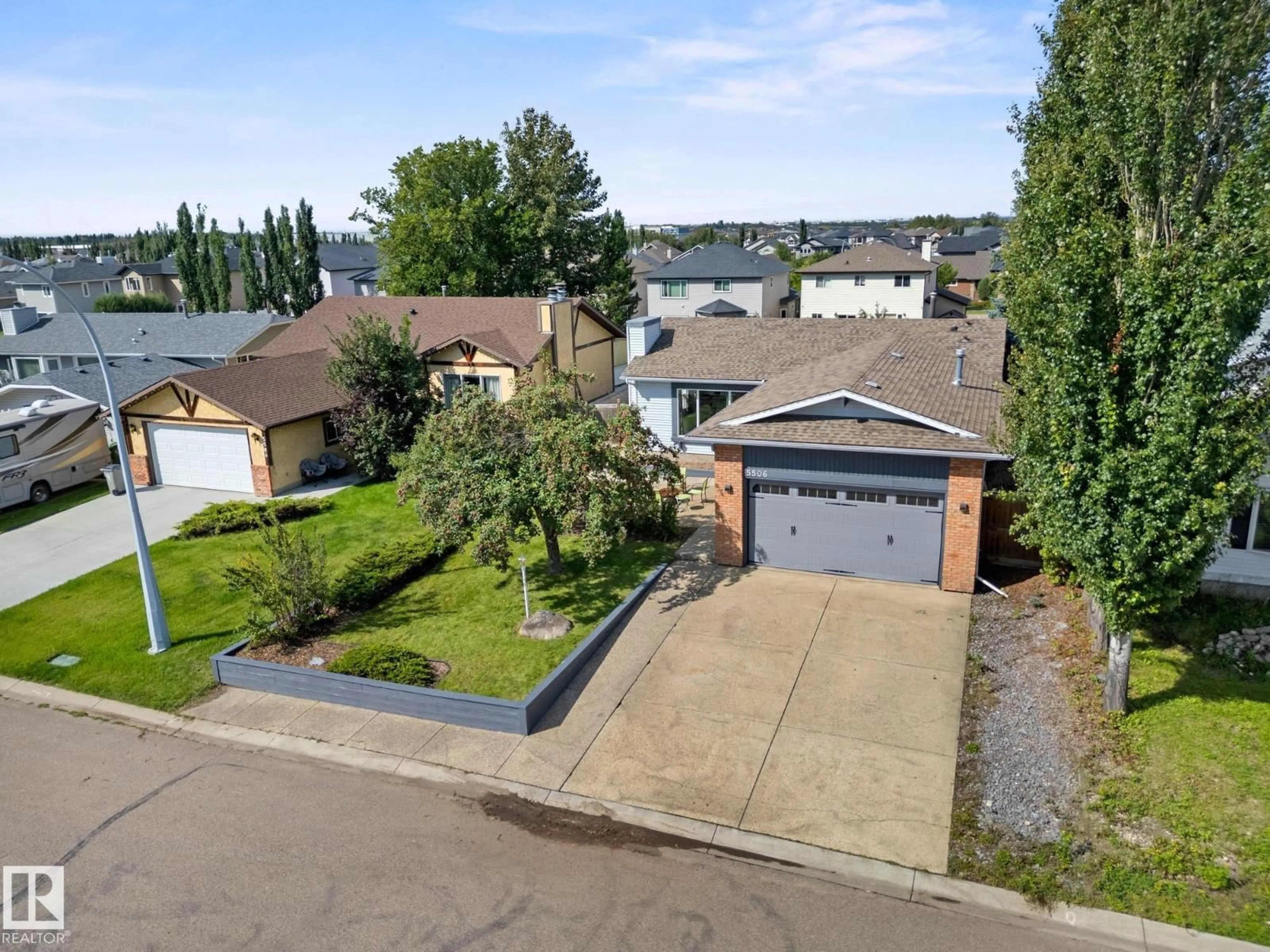 A pic from outside/outdoor area/front of a property/back of a property/a pic from drone, street for 5506 59 ST, Beaumont Alberta T4X1B2