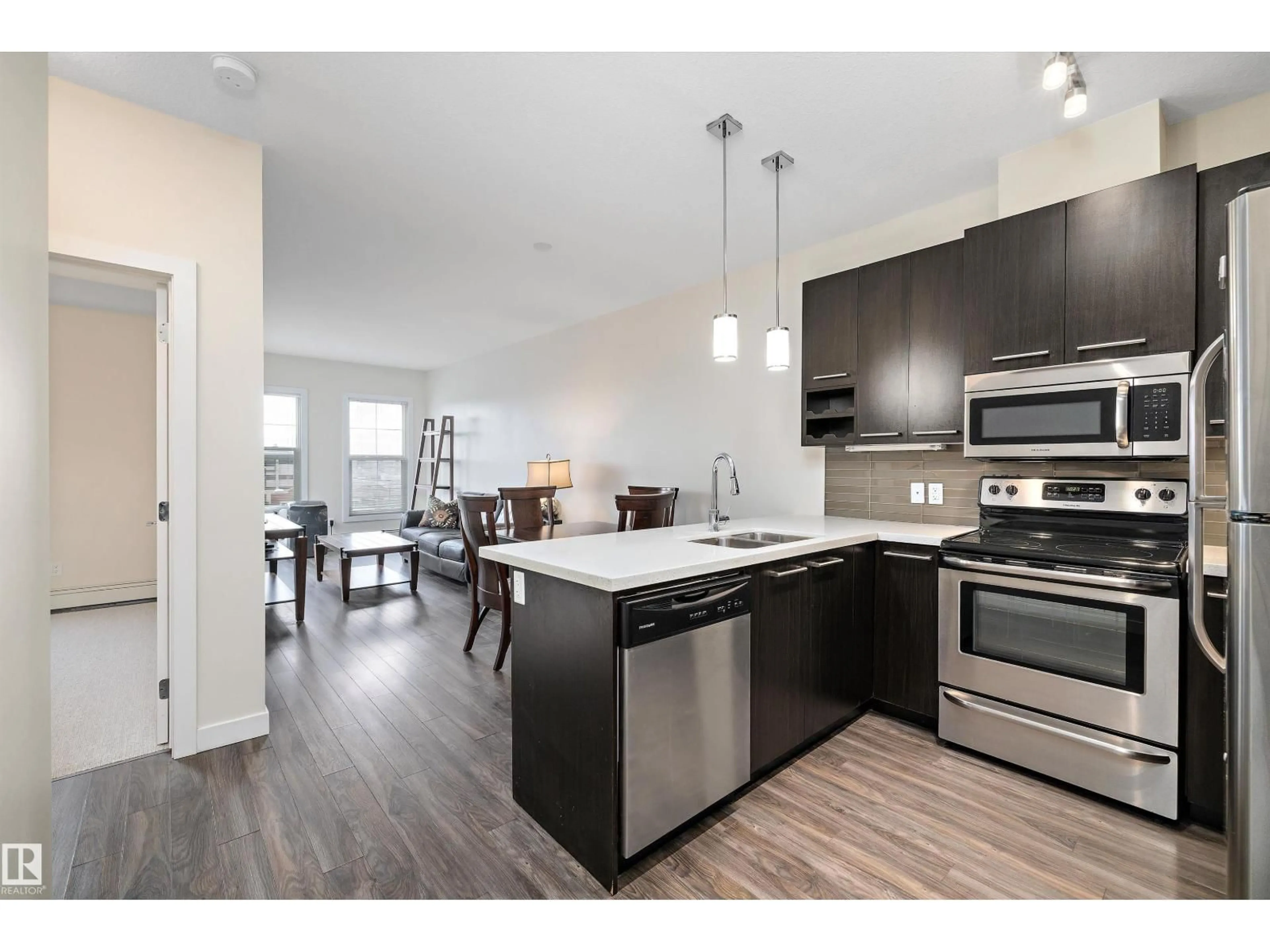 Open concept kitchen, wood/laminate floor for #408 - 10418 81 AV, Edmonton Alberta T6E1X5