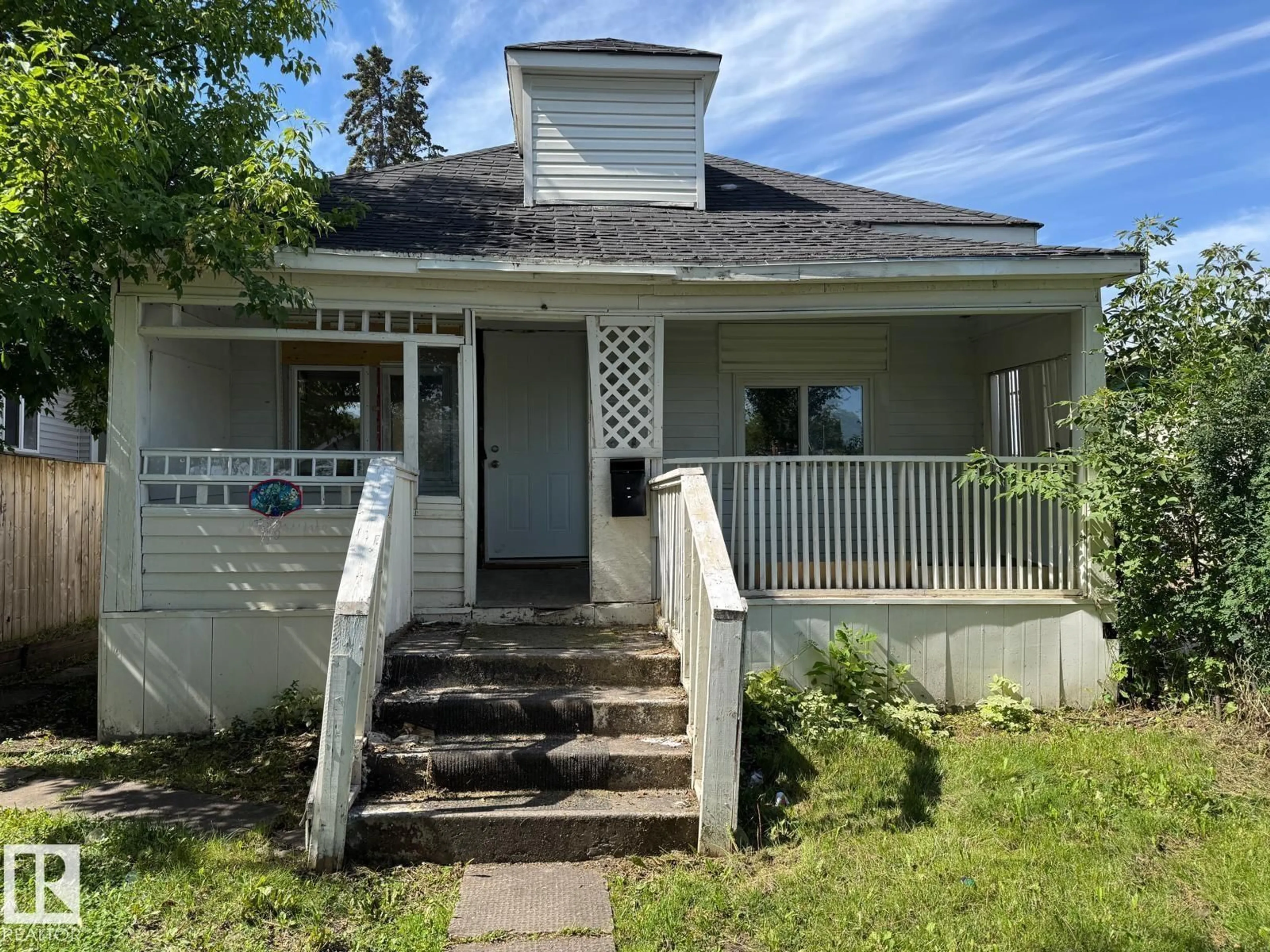 Home with vinyl exterior material, street for NW - 11734 87 ST, Edmonton Alberta T5B3M7