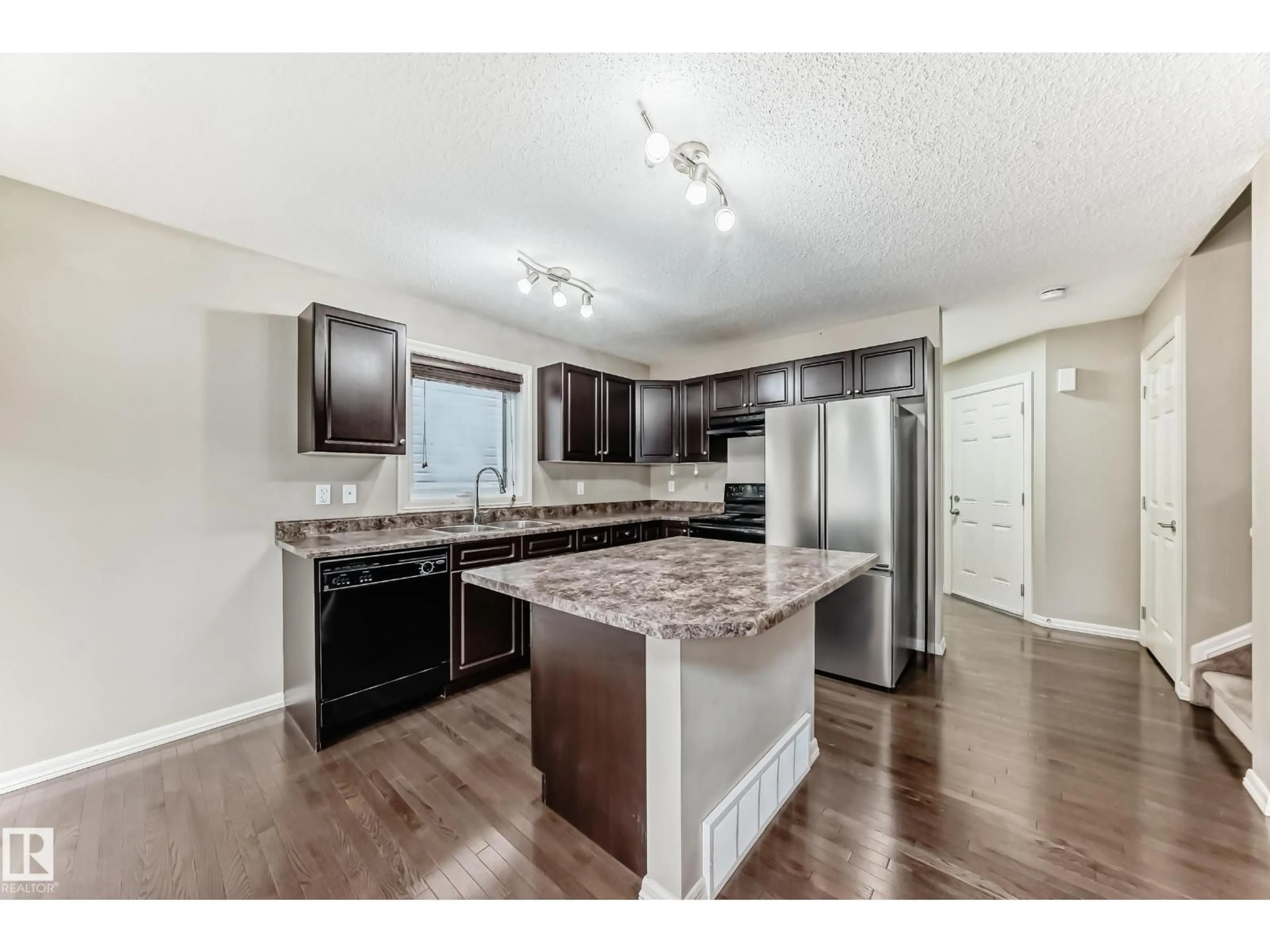 Open concept kitchen, wood/laminate floor for #7 - 655 TAMARACK RD, Edmonton Alberta T6T0N4