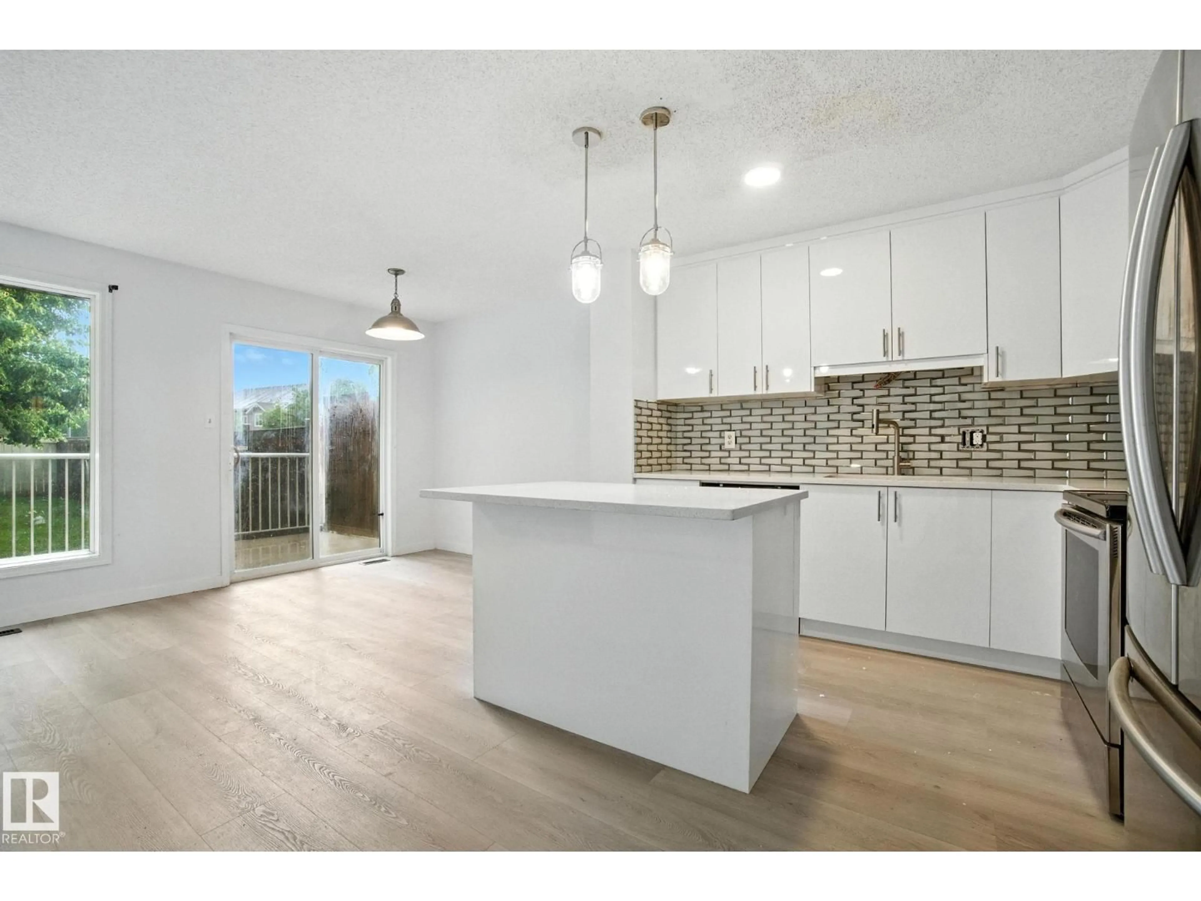 Open concept kitchen, unknown for 7931 7 AV SW, Edmonton Alberta T6X1N3