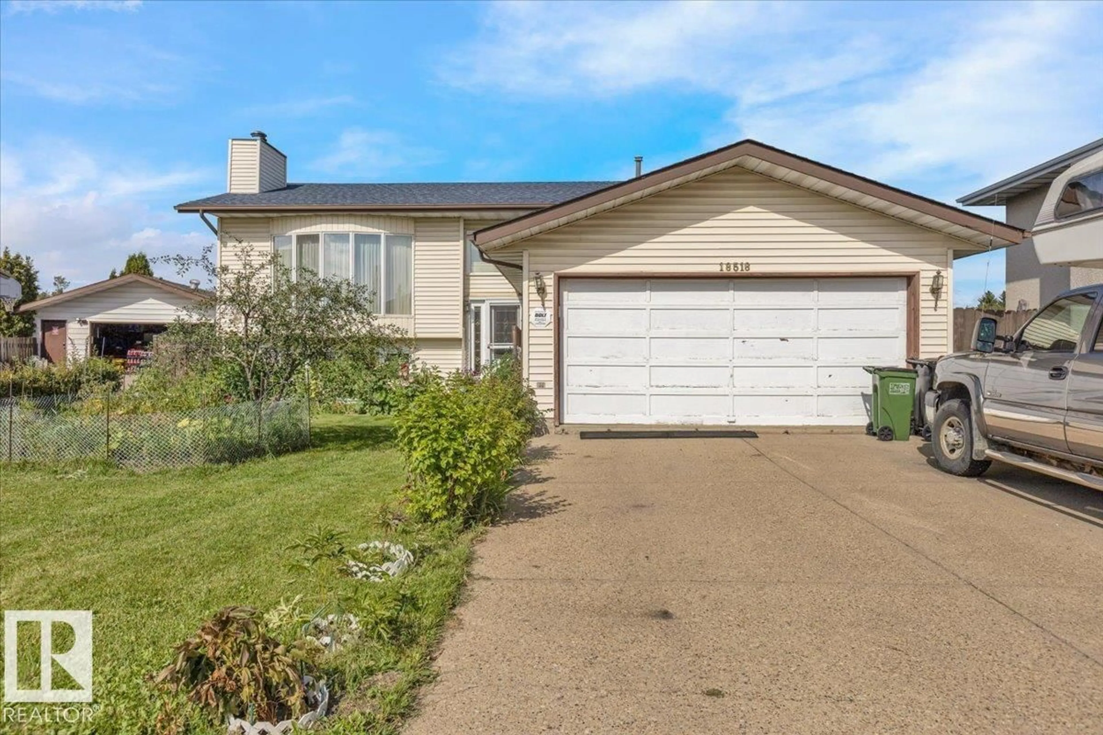 Home with vinyl exterior material, street for 18516 96 AV, Edmonton Alberta T5T4M4