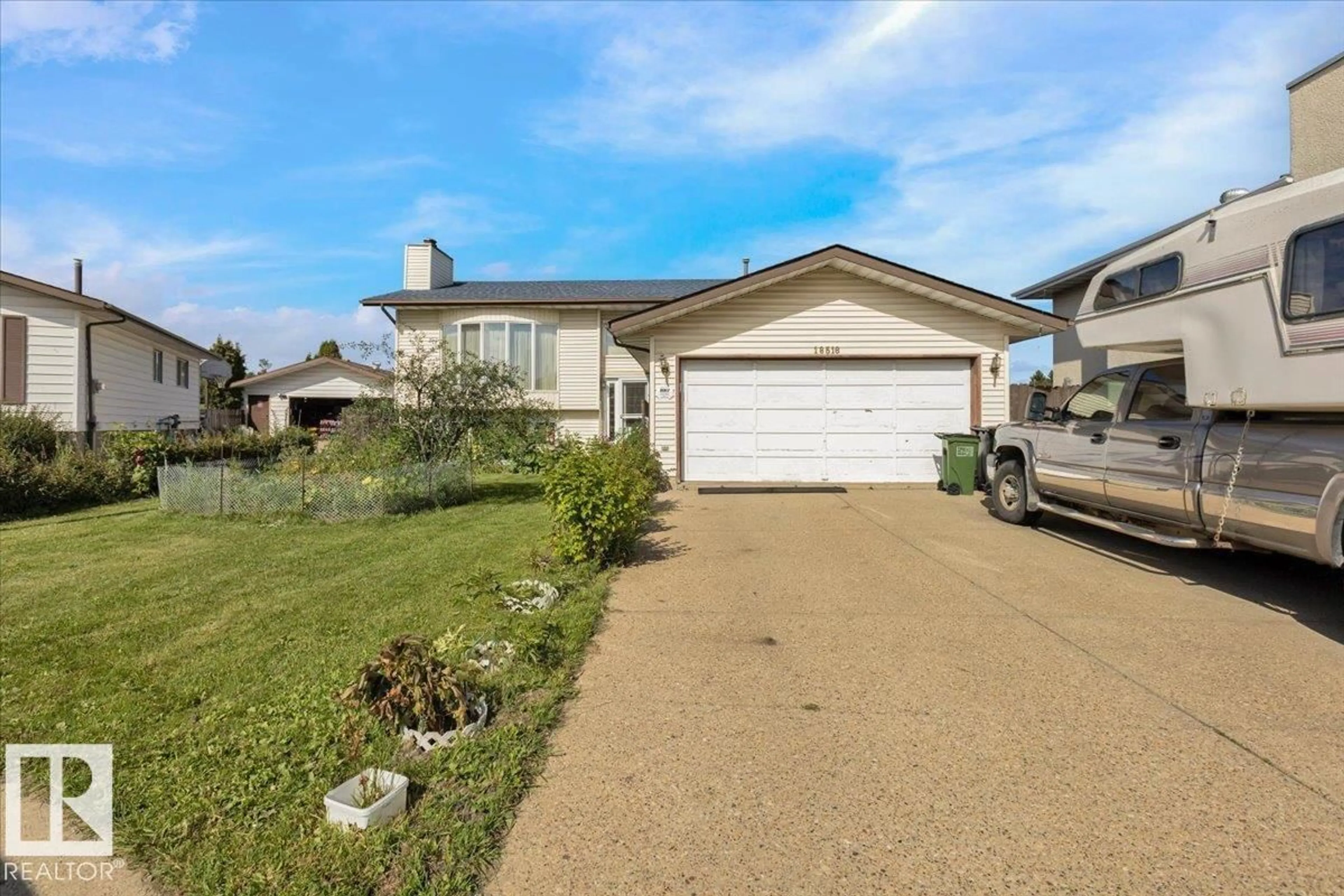 Home with vinyl exterior material, street for 18516 96 AV, Edmonton Alberta T5T4M4